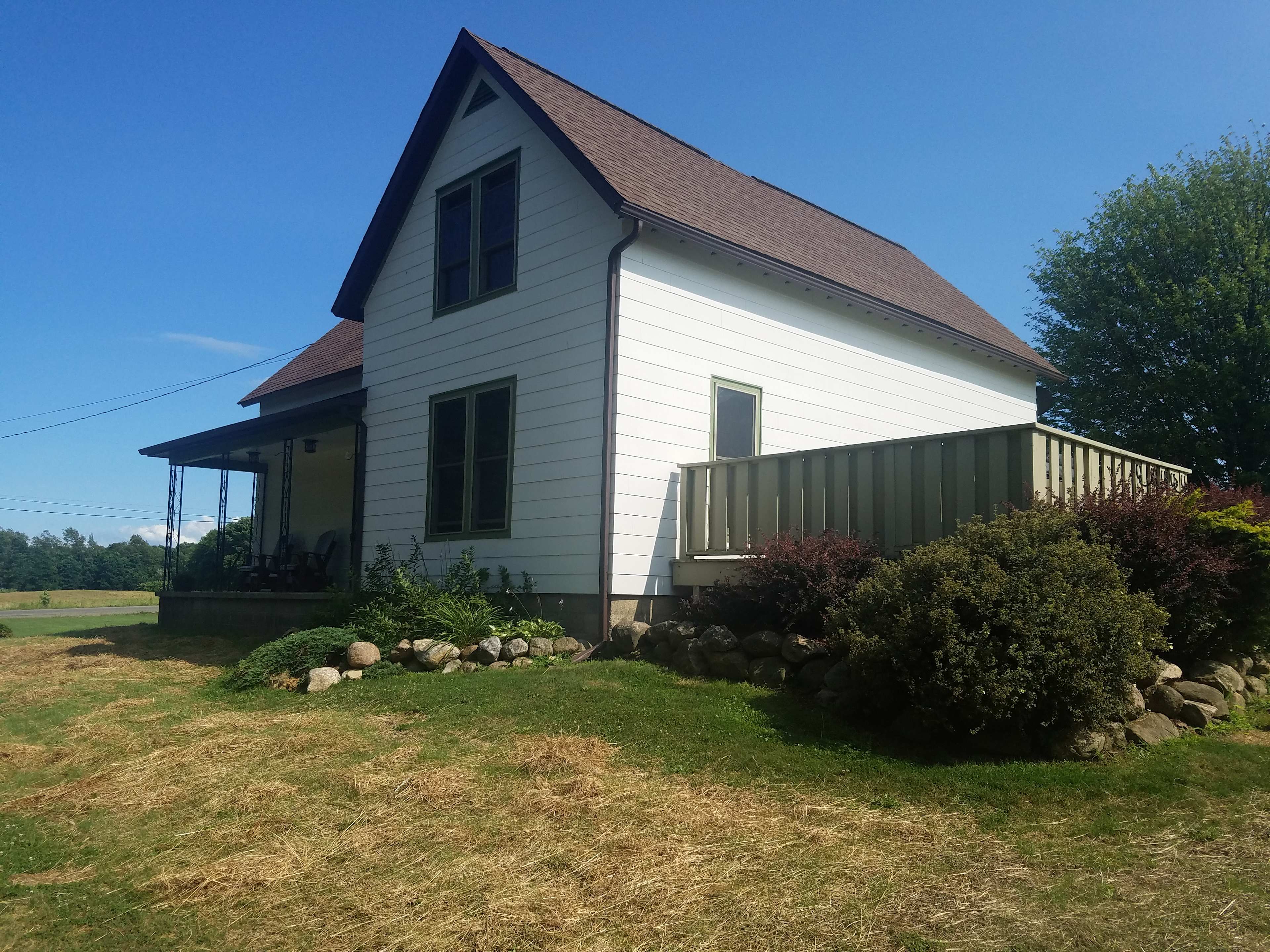 Cozy country farmhouse with ample porch space for outdoor relaxing