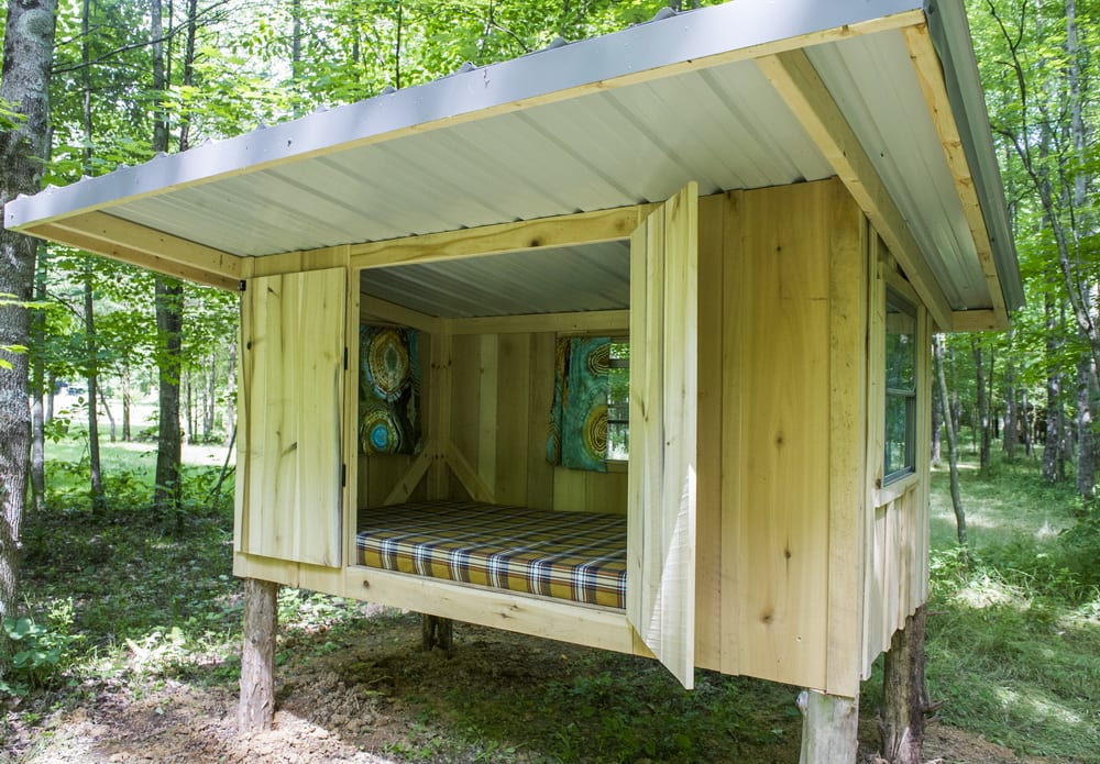 Our Cozy Camping Cottage has a 4 foot opening so you can be outside and inside at the same time. 