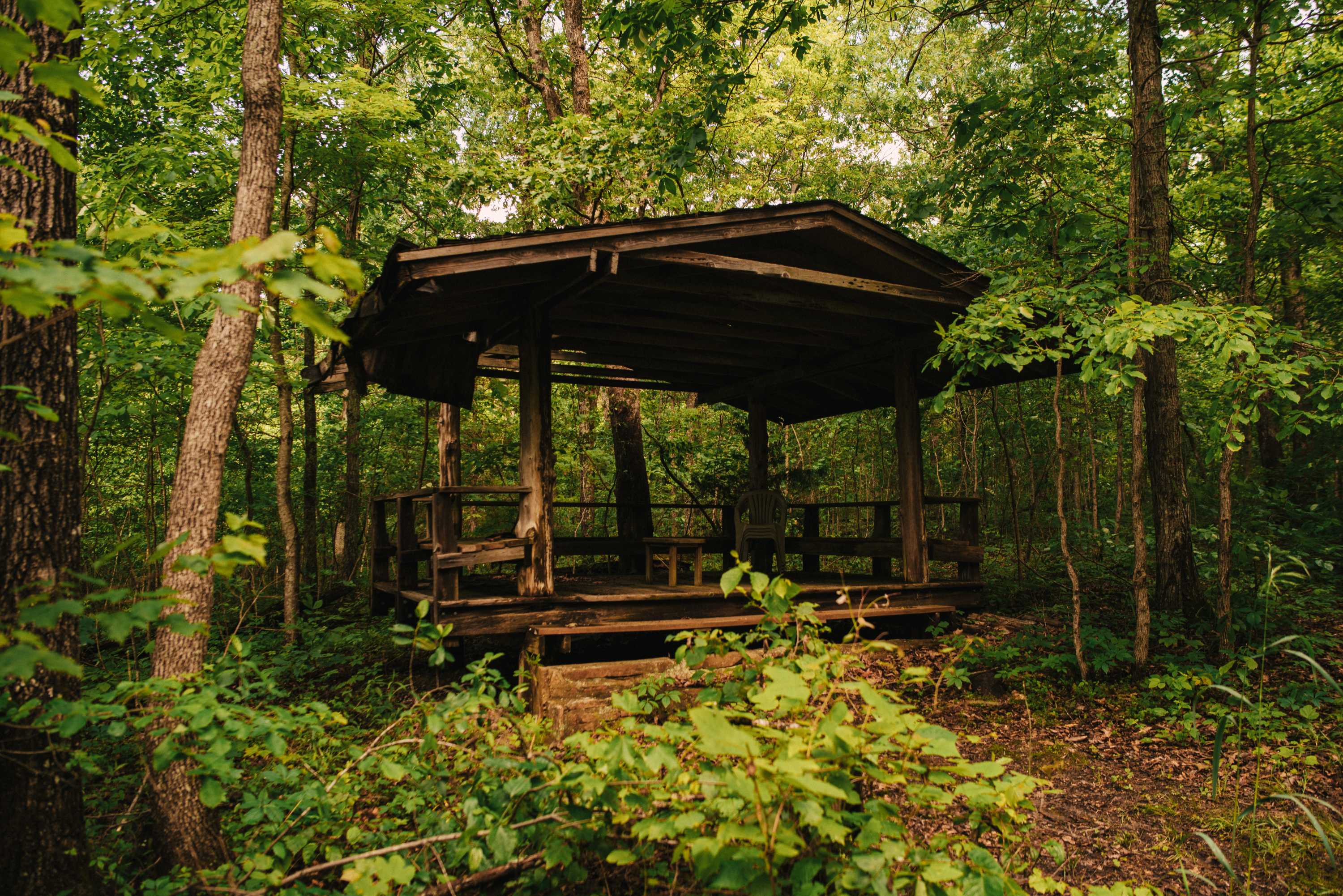 More structures in the woods.
