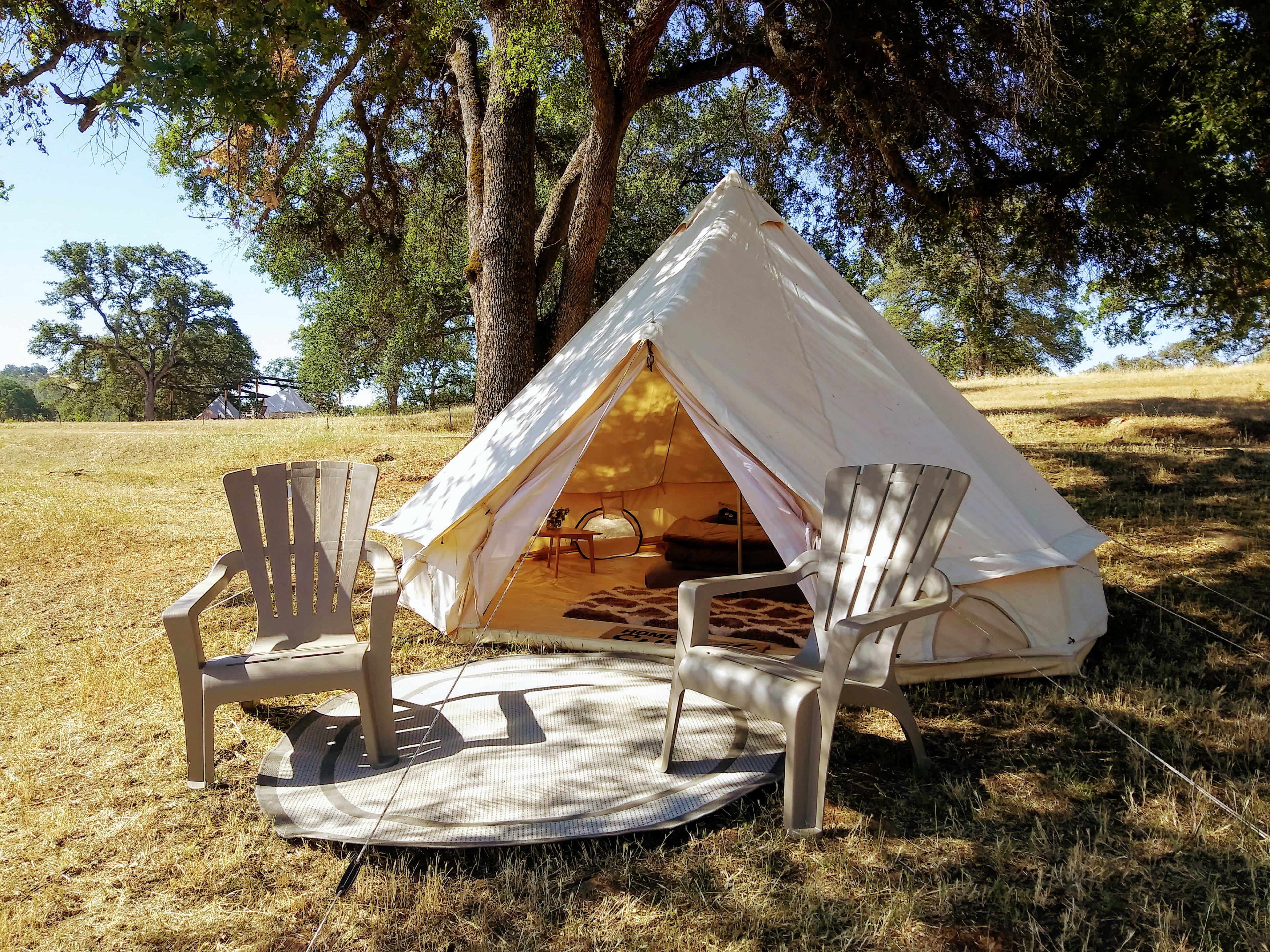 Yurt style tent with outdoor chairs