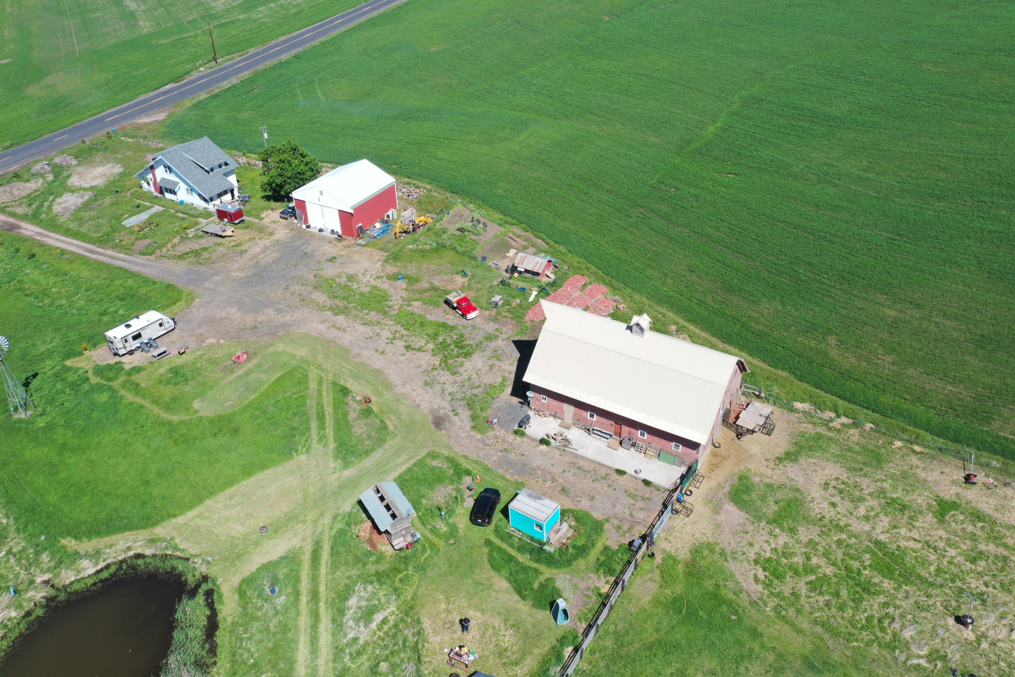 aerial view of RV-Camp and CarCamp@BlueShed looking NW with barn, shop, and farm house.  Approx. 10 acres to the "south" of this photo