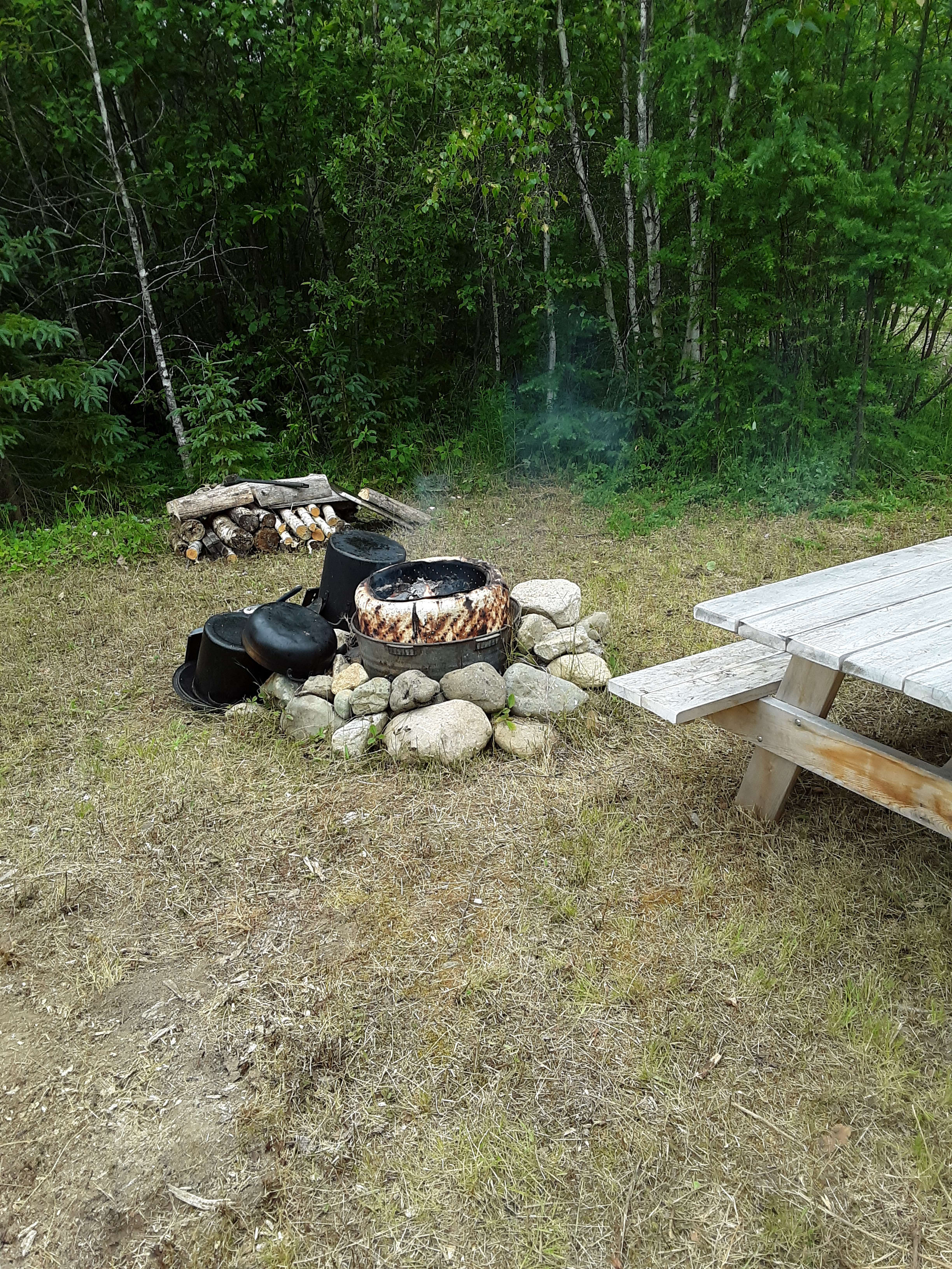 Open fire pit.  This pit is in front of our RV feel free to use the pots and pans,  and picnic table.  Depending on where you set up by our RV or in the open area by the other fire pit!