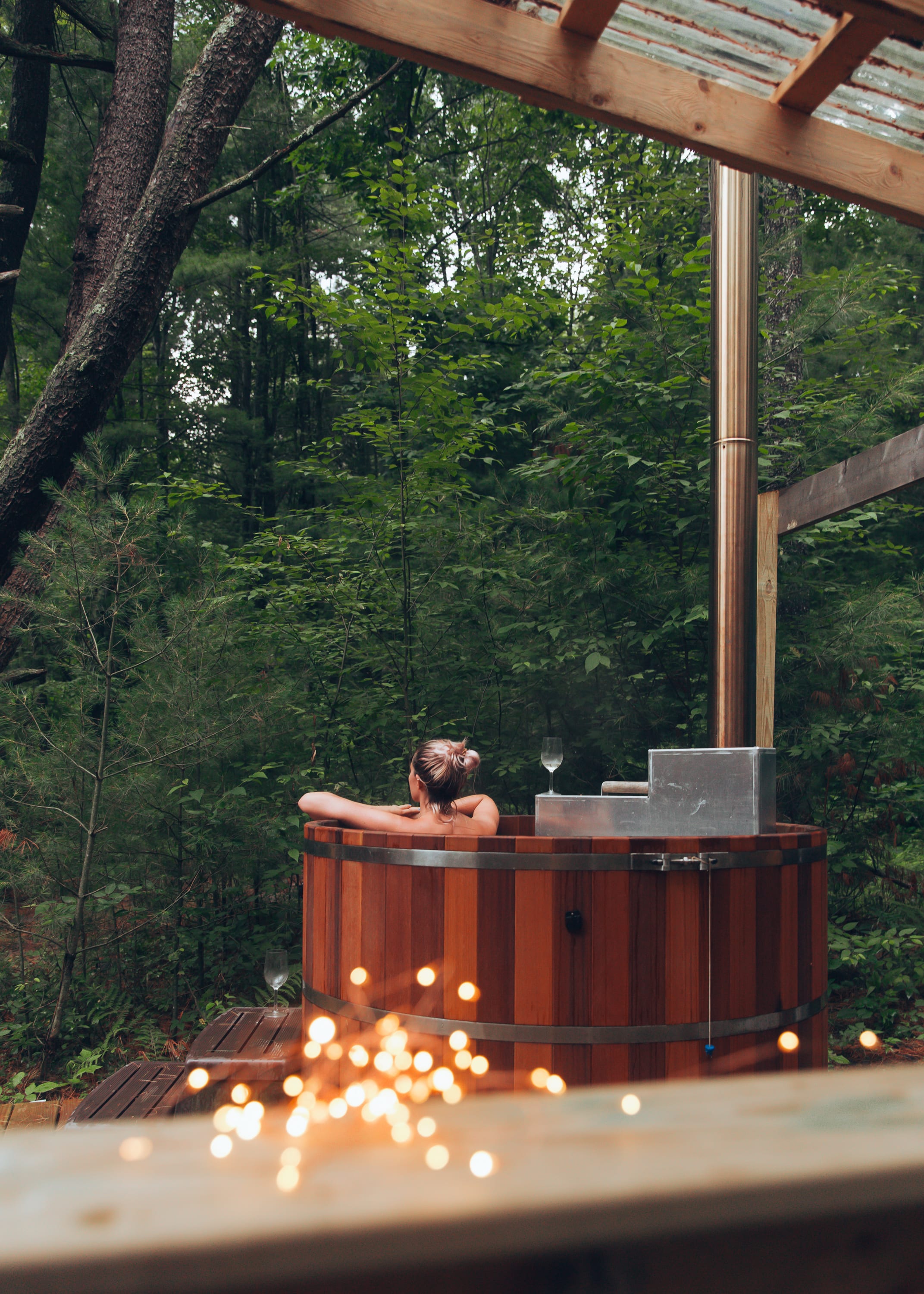 Woodfired cedar hot tub for ultimate relaxation