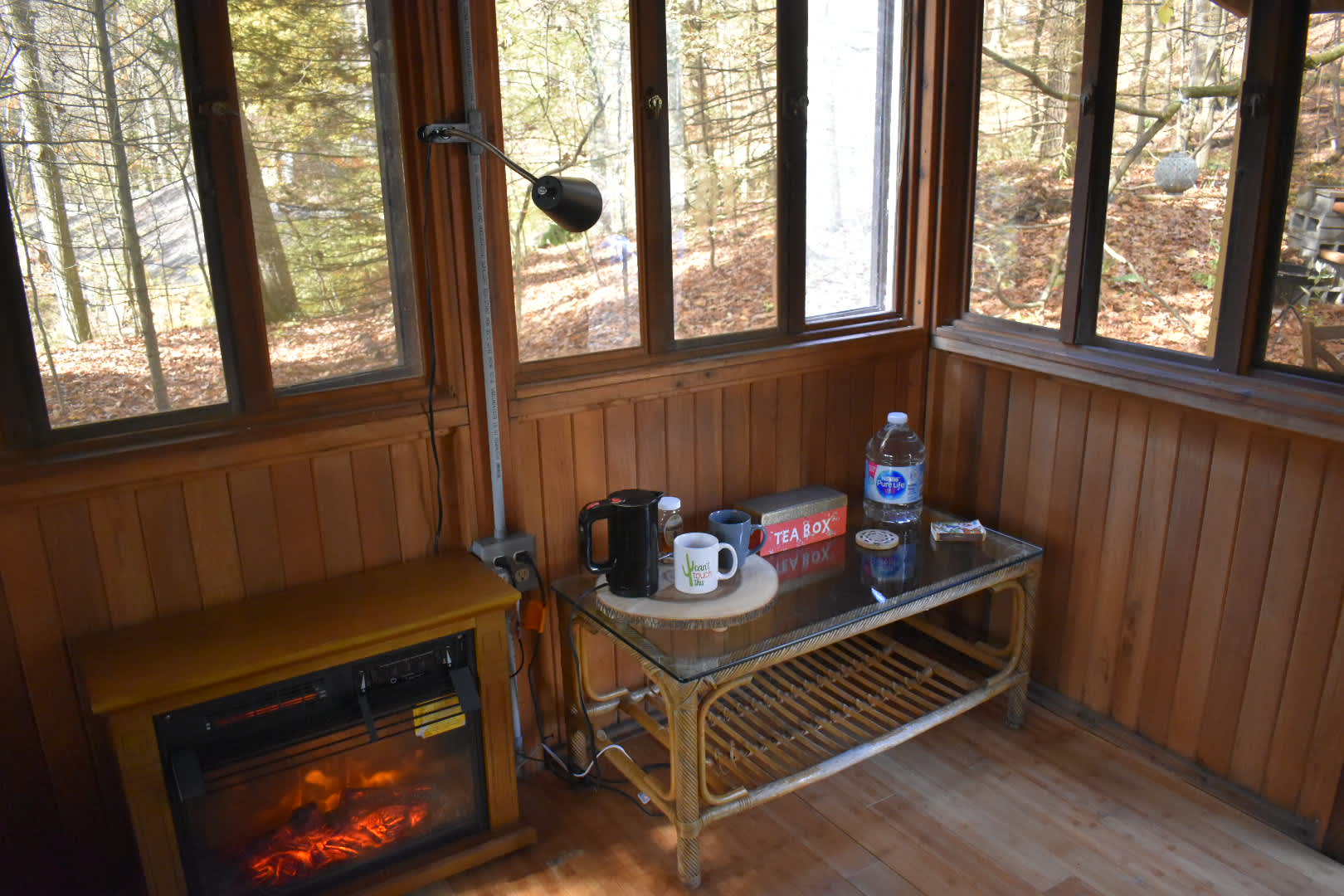 Coffee table with tea kettle and tea bags for your convenience.