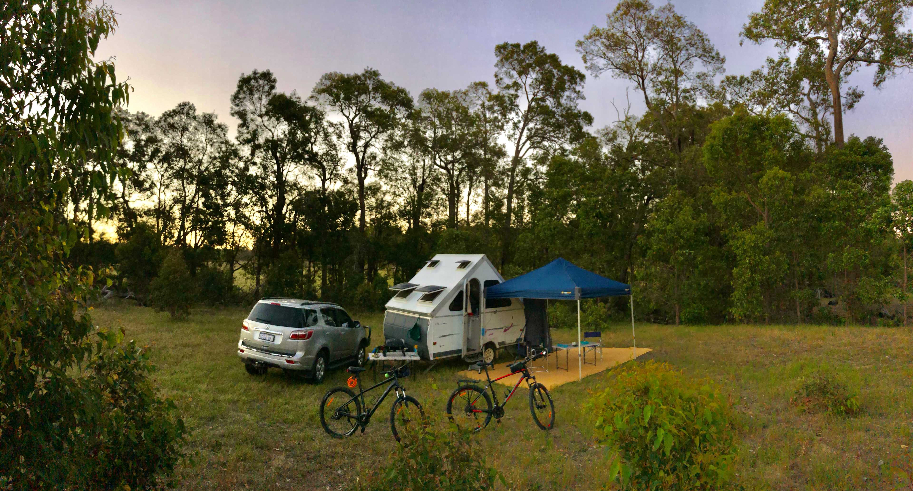 Our site at Creek Junction. Used one ramp to level the van. Ground easy for pegs. Trees sheltered us from westerly wind. 