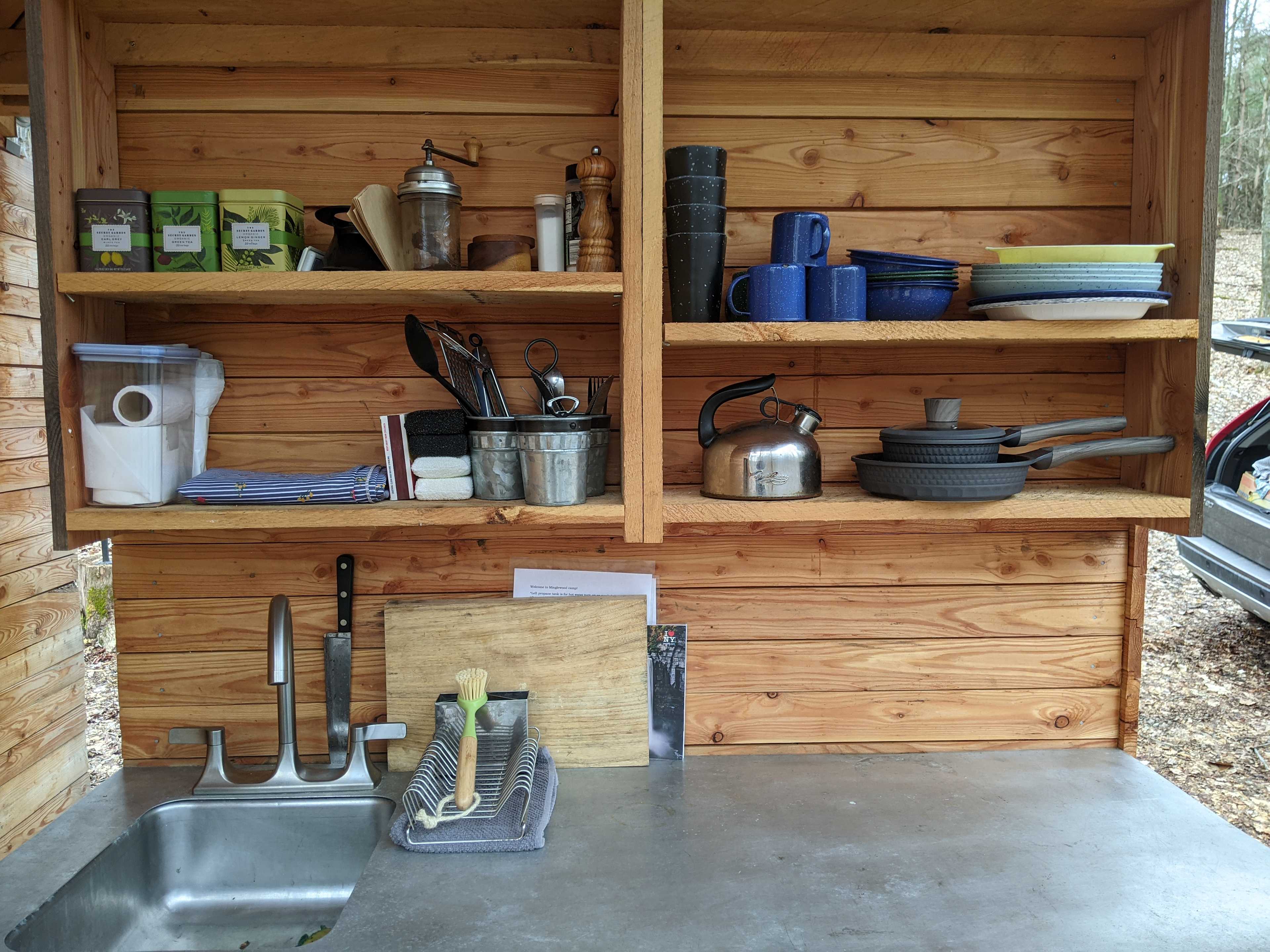 Our camp kitchen is equipped with basic dishes and cookware. 
