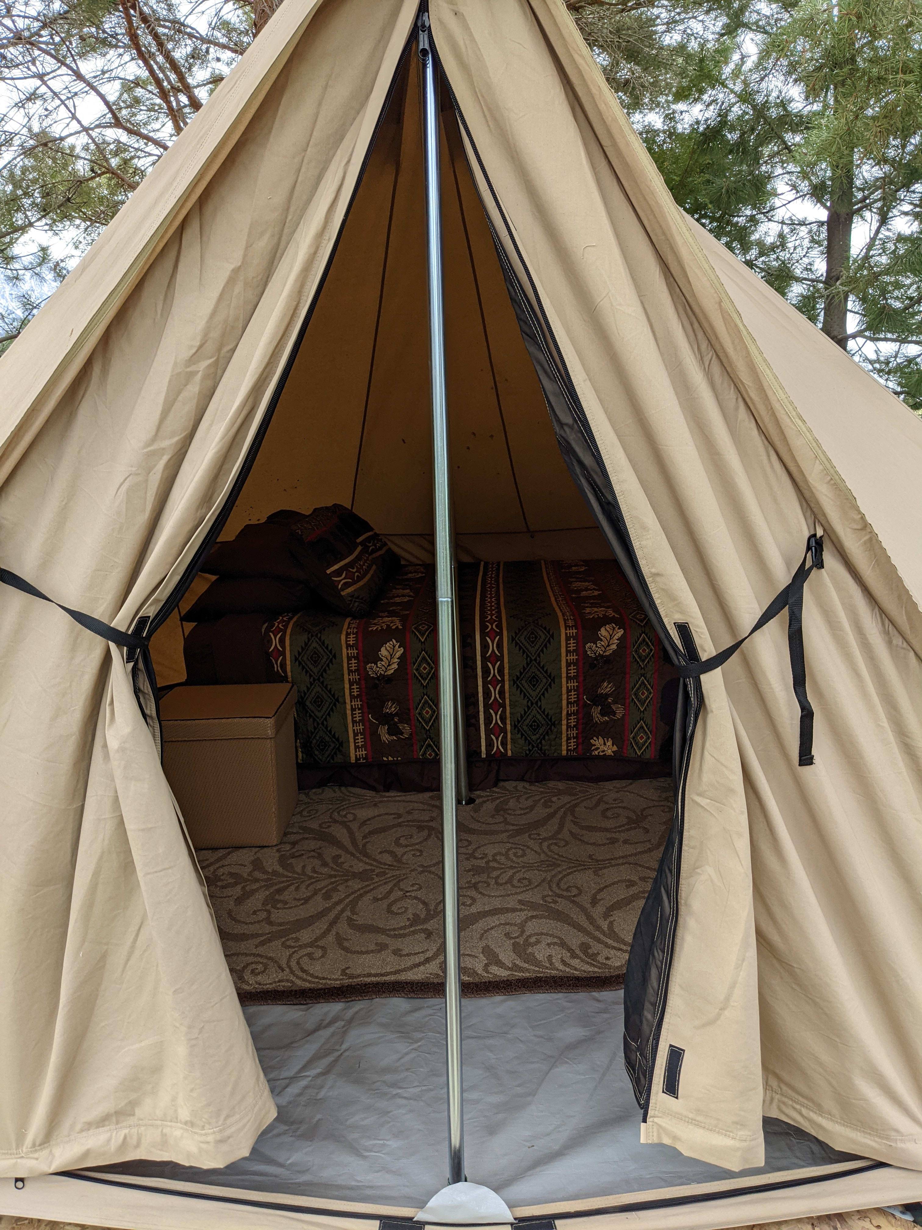 Magical Bell Tent hidden in the cove of trees. Queen bed with deluxe linens