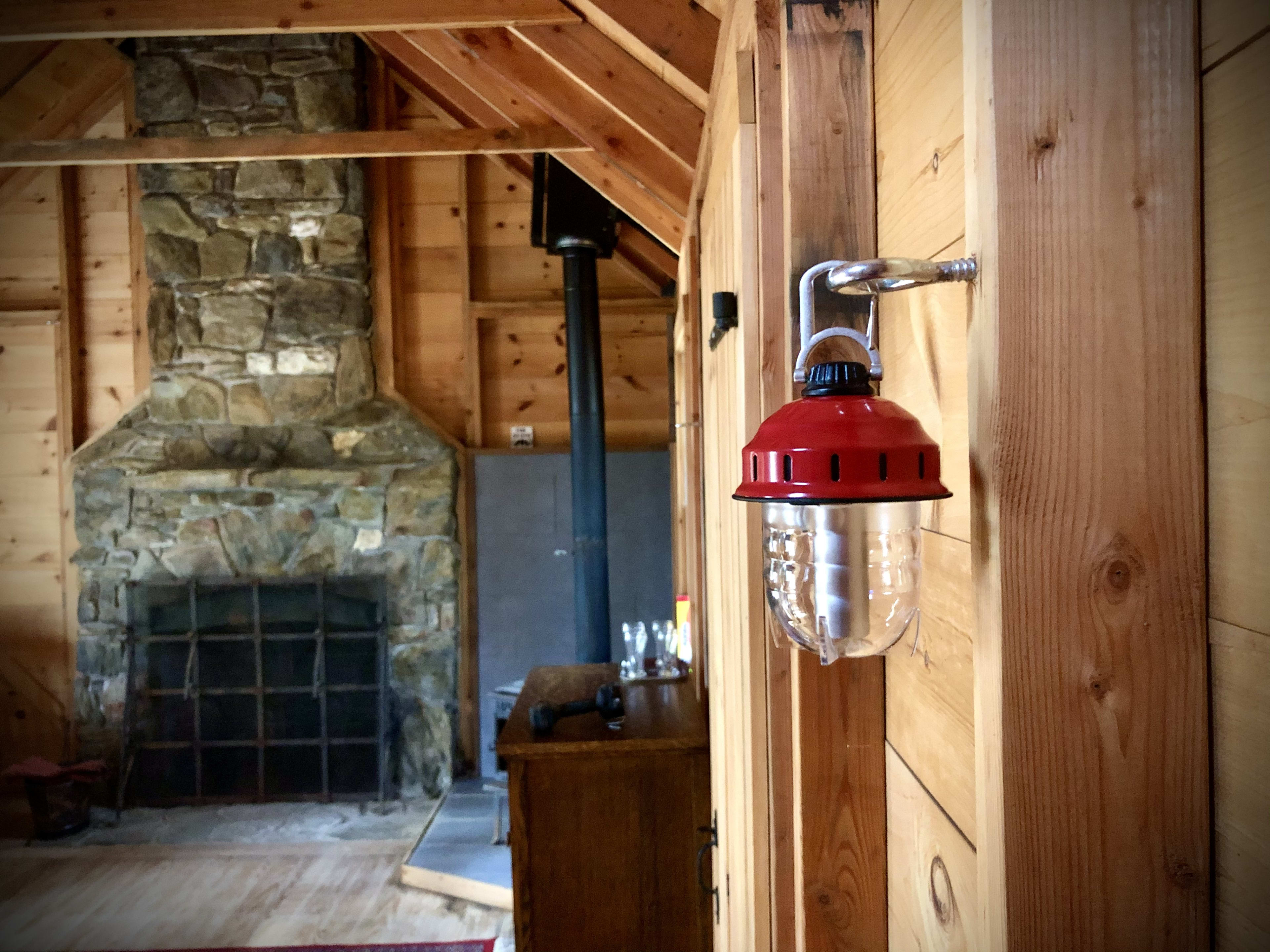 Your stone fireplace is built for wonderful summer fires while your wood burning stove is great for taking the chill out of colder nights.
You'll also have at least three battery powered USB rechargeable lanterns to use for your trip.
