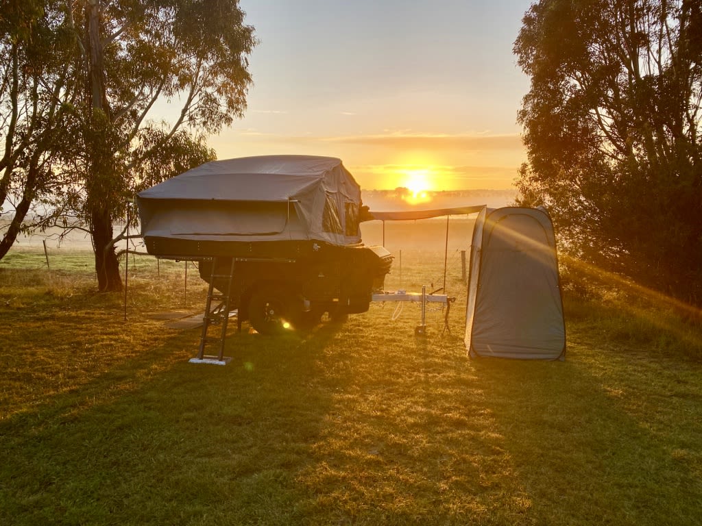 Photo sent by guest - campsite view of sunrise over wetlands