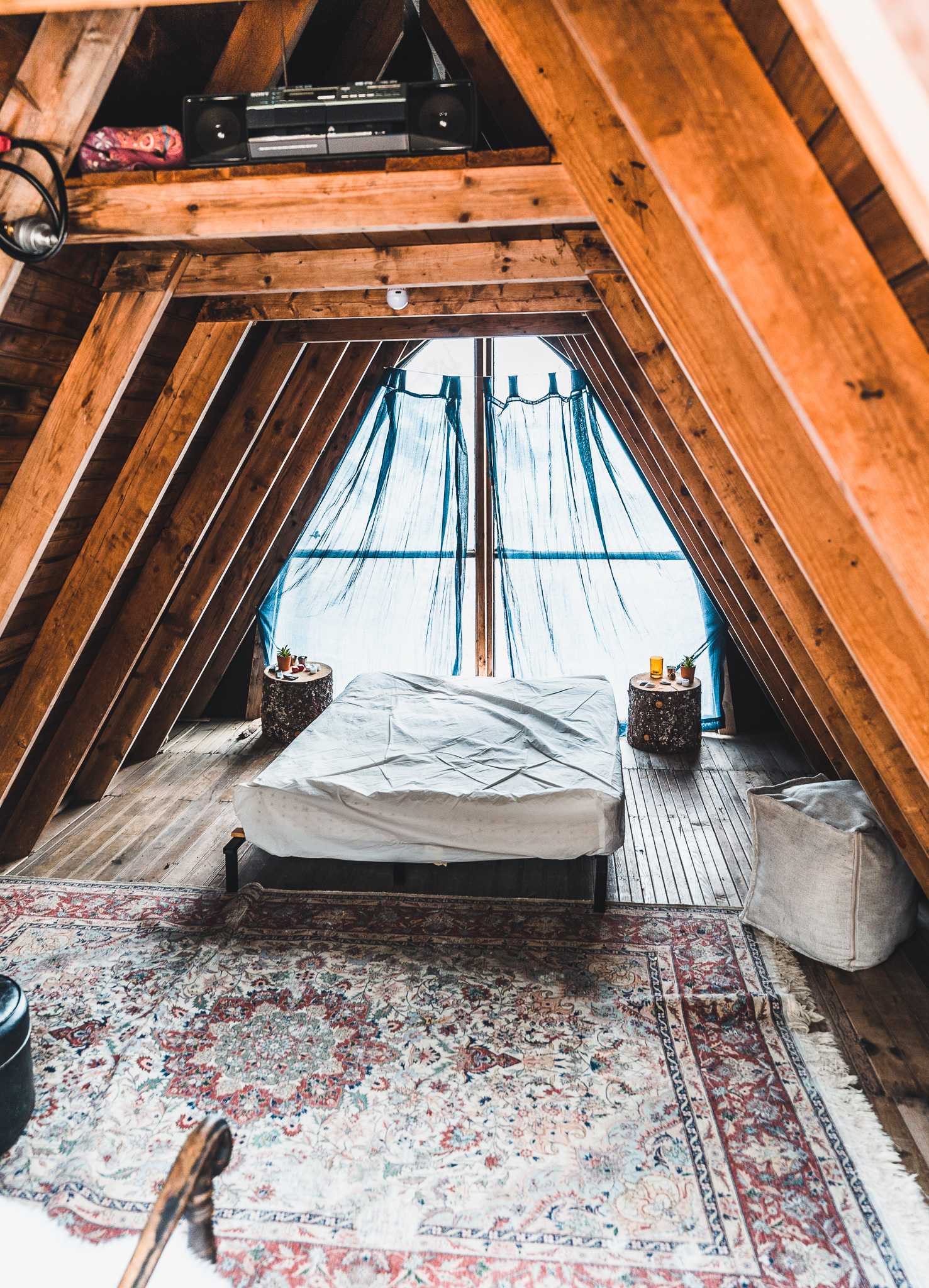 The interior of the cabin. It is absolutely adorable, feels rustic and there are even little candles on the bedstands