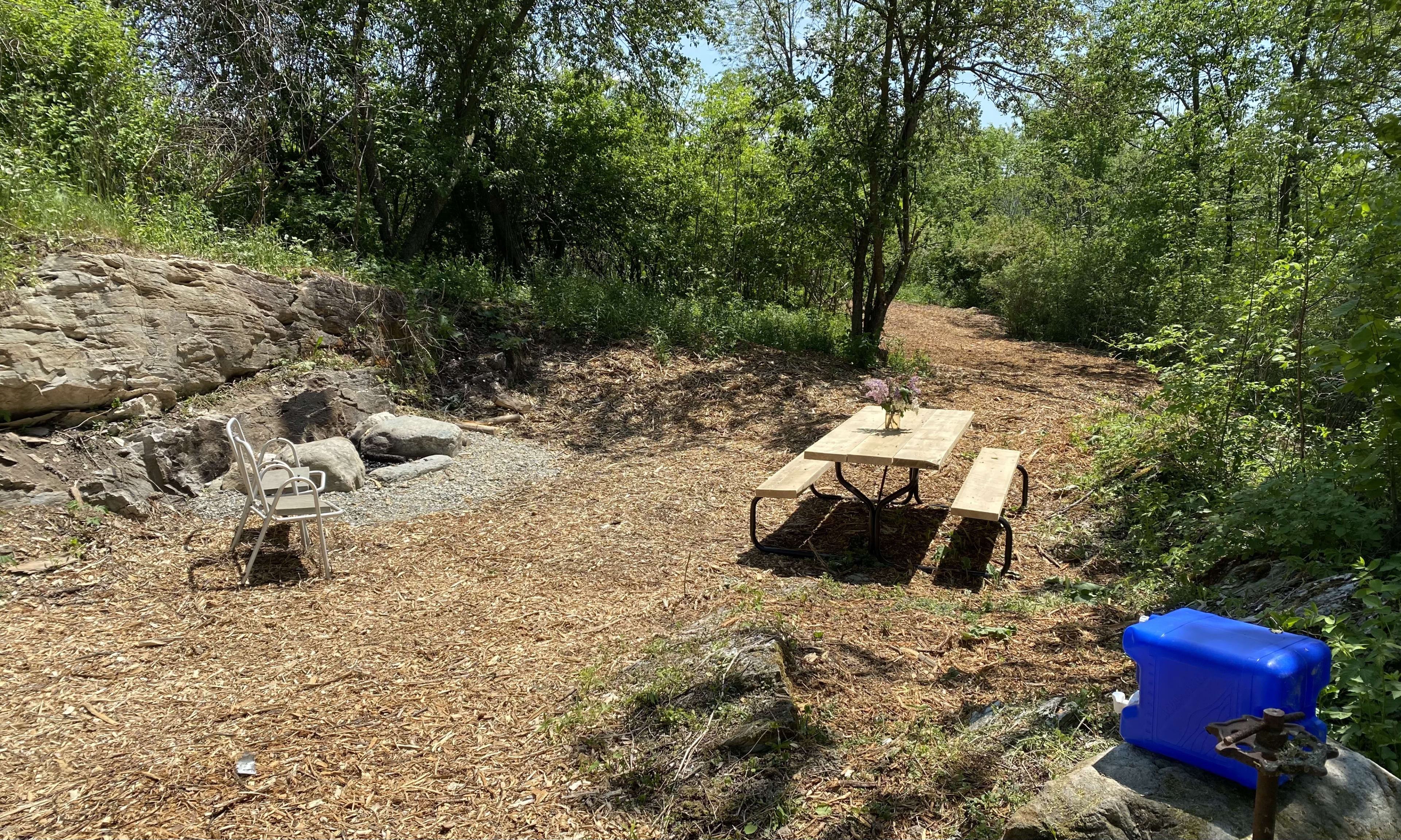 Each campsite has a wood picnic table, firepit and lots of room for games like cornhole.