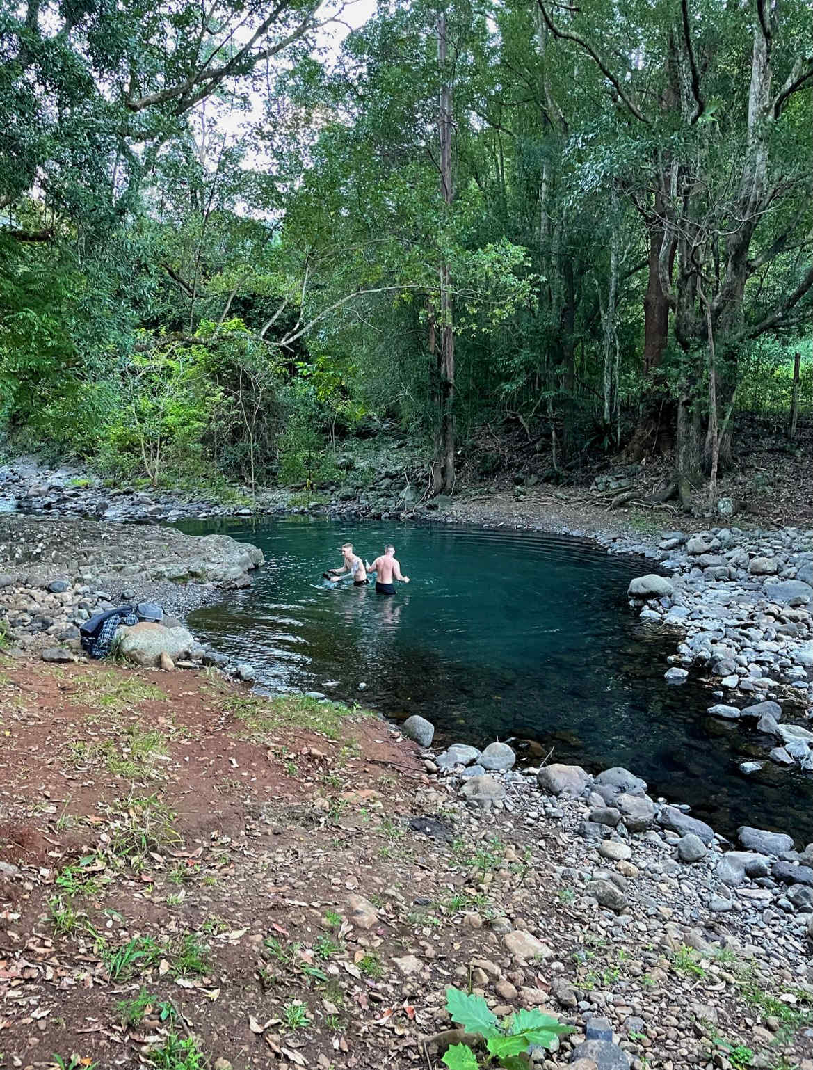 Friends having a chilly morning swim at the campsite.