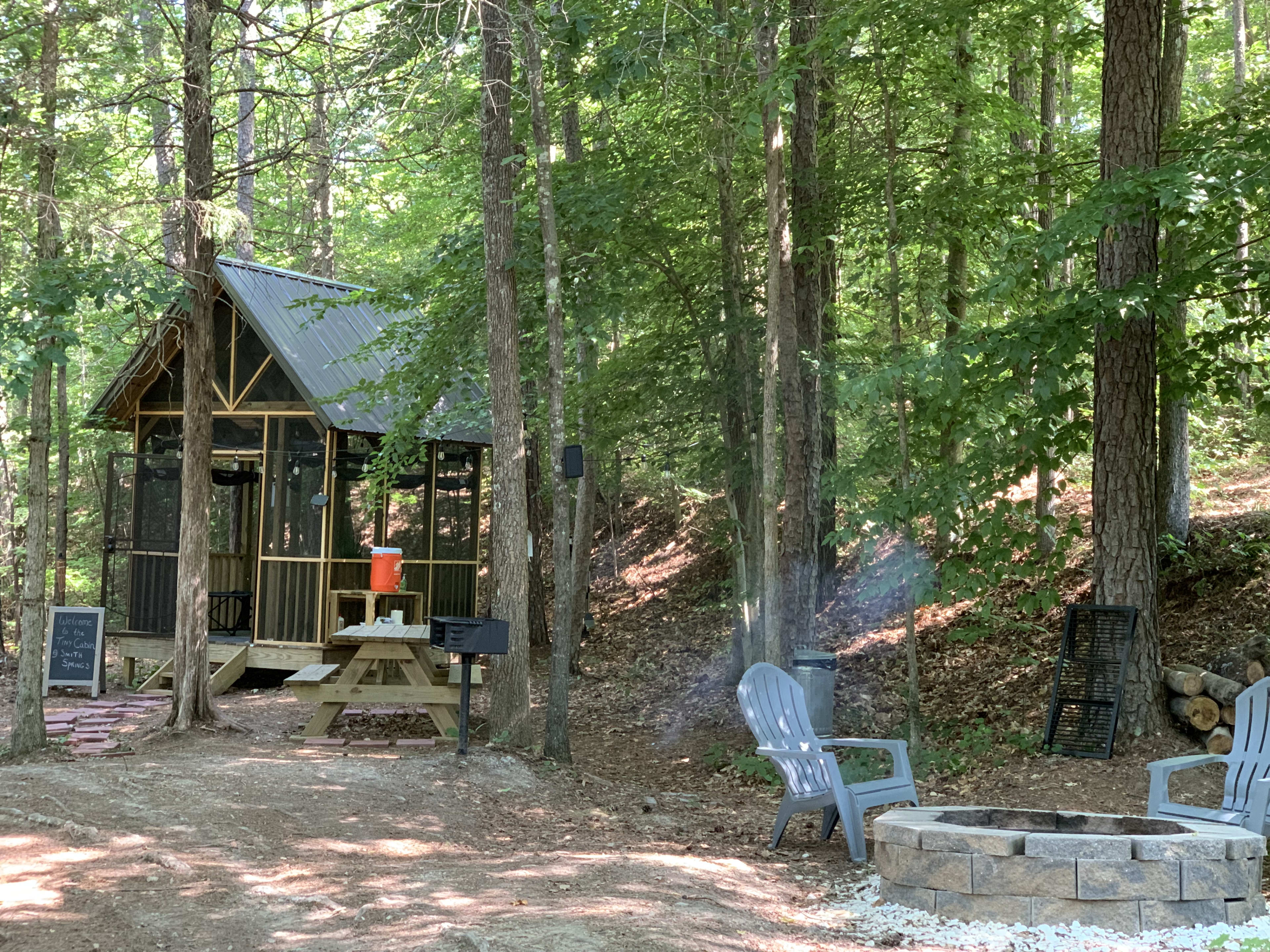 “Retreat” area includes use of Tiny Cabin, Firepit, Park Grill, and Picnic Table with a warm water Wash Station, and Porta Toilet.