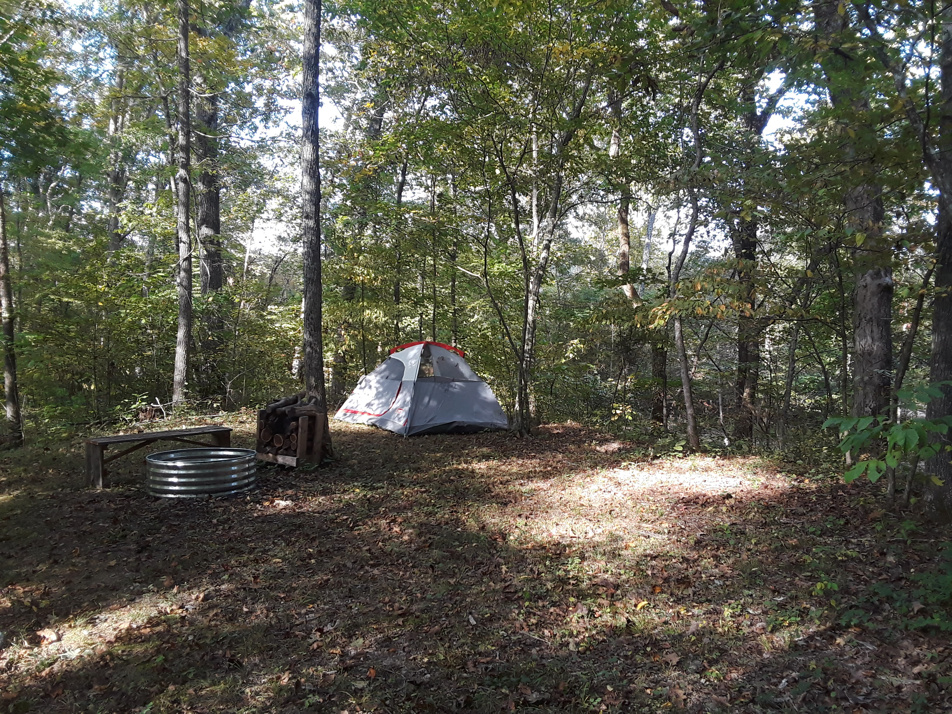 This is campsite 2 located near the creek not on it like 1 is. It’s the smallest of them all but surrounded by woods an closest  to the outhouse.  It can hold 2 maybe 3 small size tents.