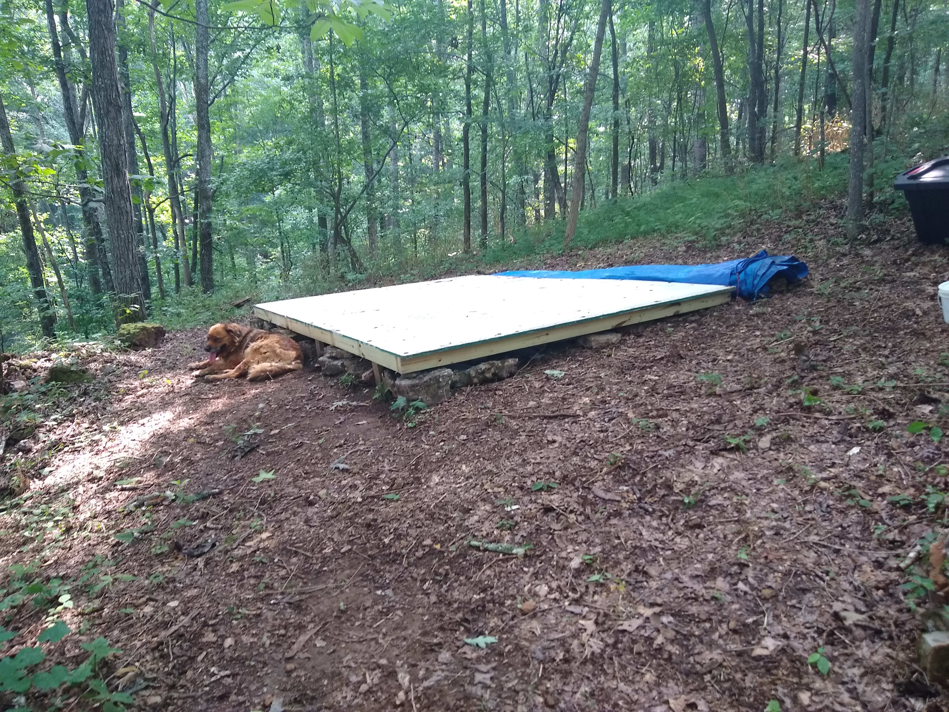 Tent platform. Keeps you off the ground and provides a level space for your tent.