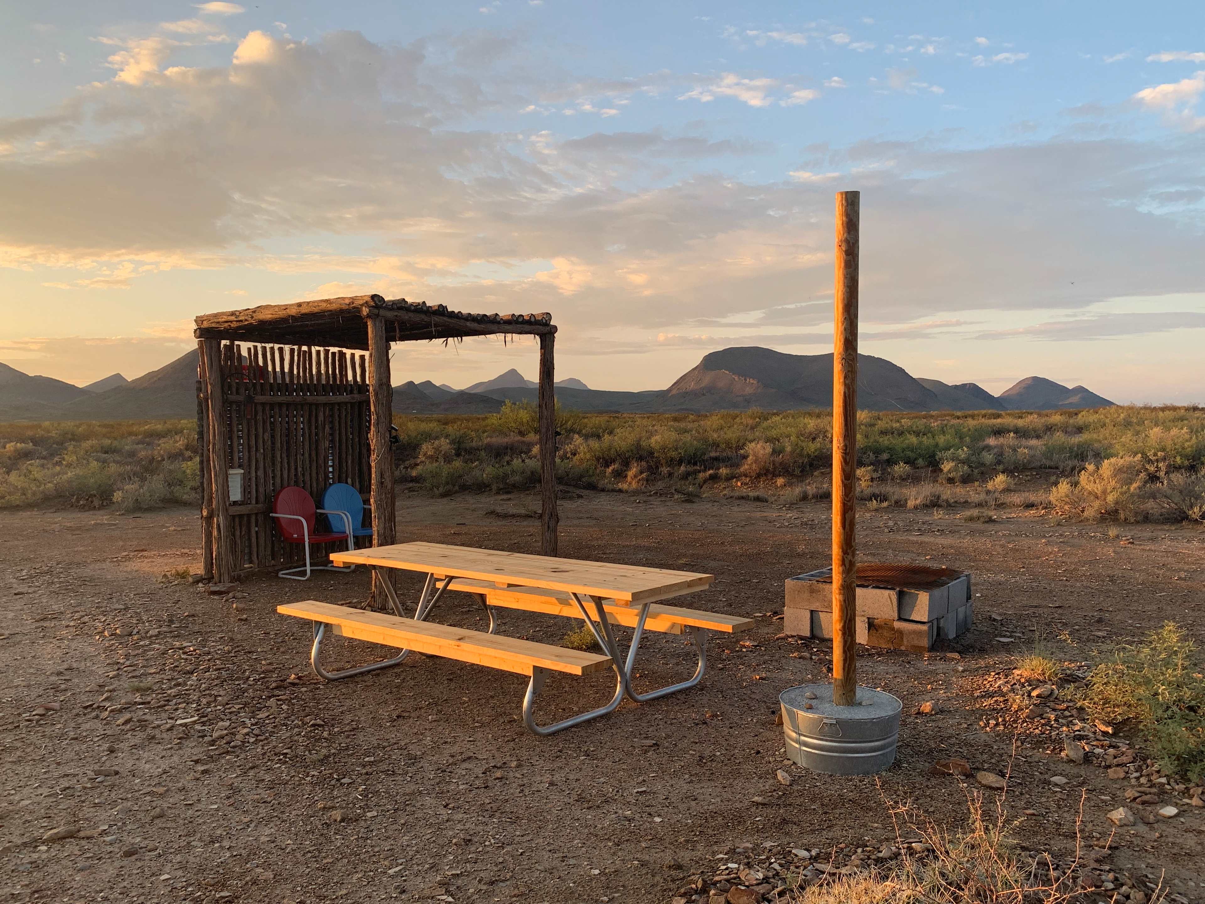 8'x8' Ramada with 8' picnic table, two chairs, and fire pit!