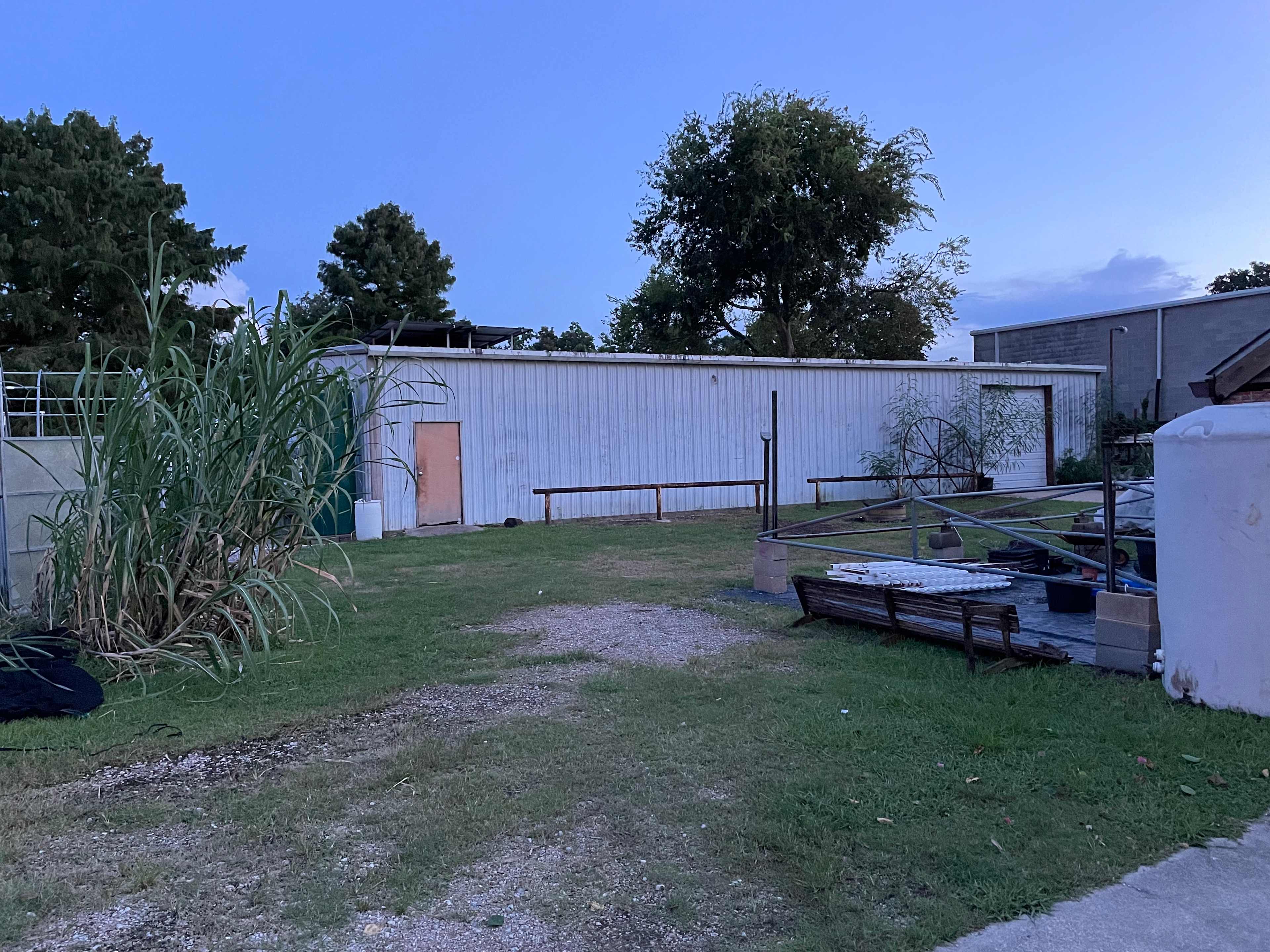 You will Park next to this white storage building 