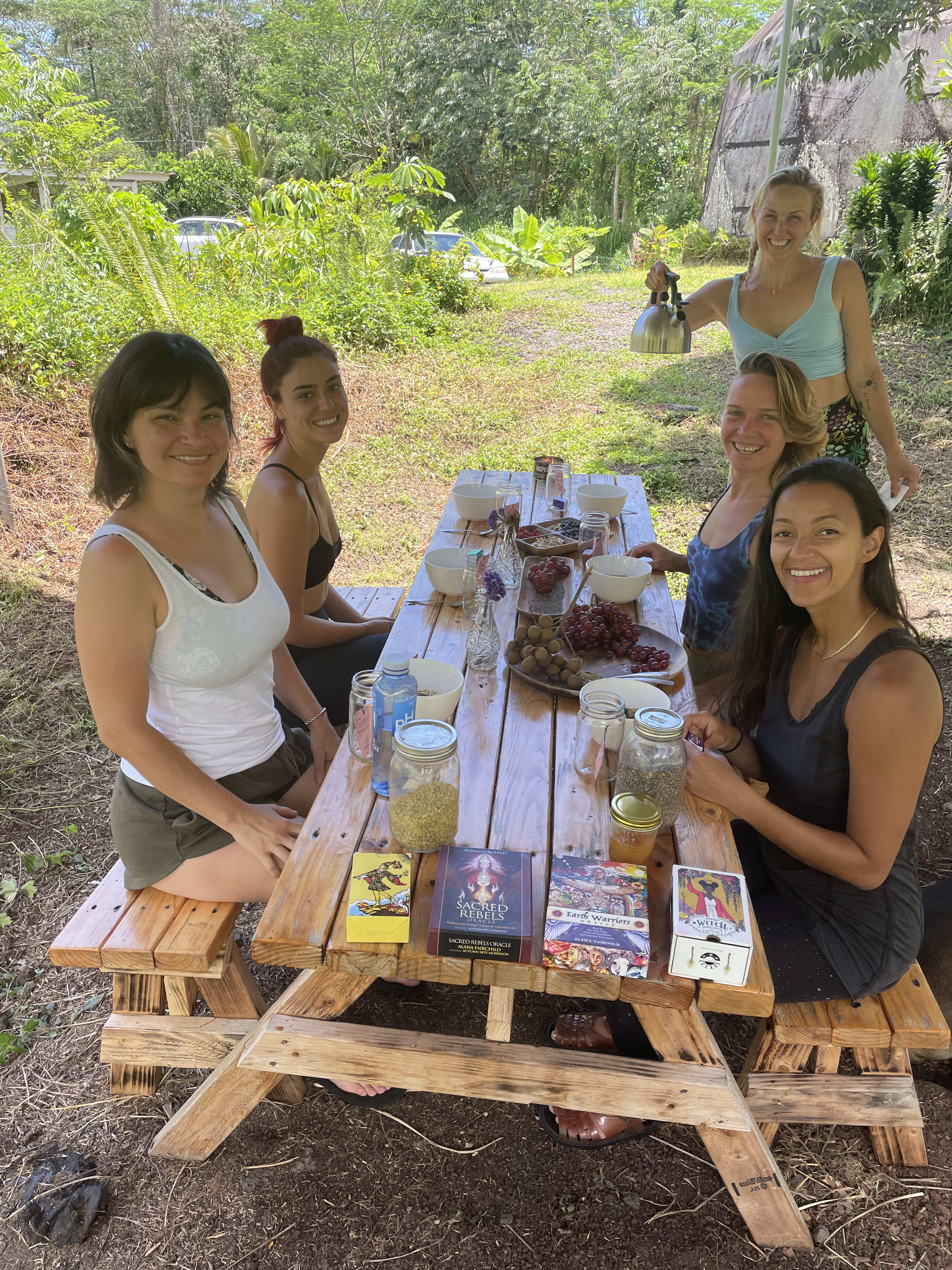 The communal picnic table is the spot to read books, draw tarot cards, create art, and chat at your leisure.