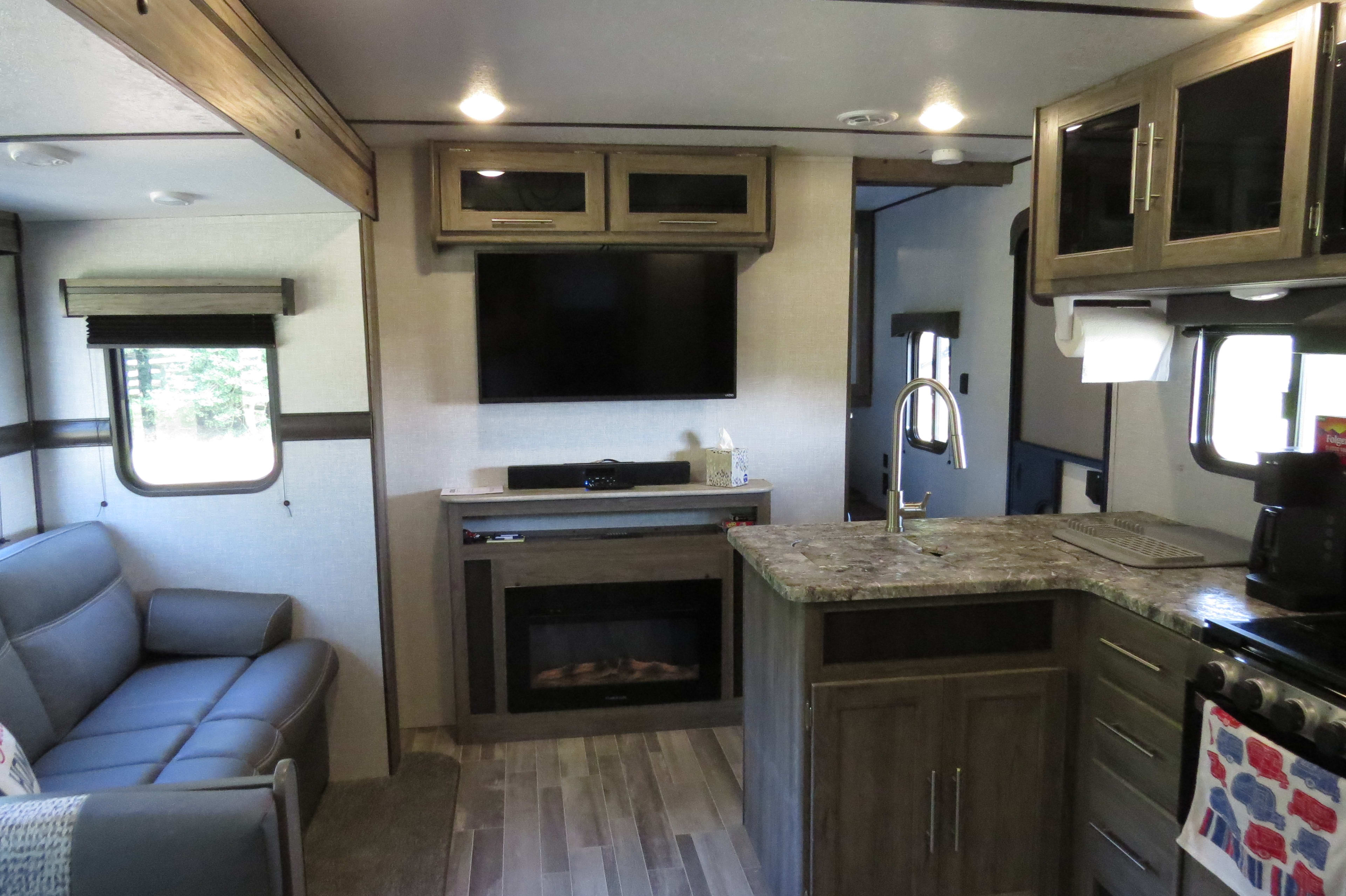 There is a tv and a radio that will play in and out of the trailer.  