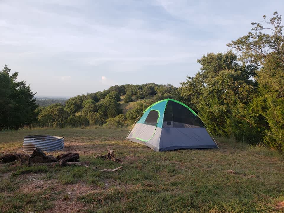 Facing north, nice flat area to set up a tent. 