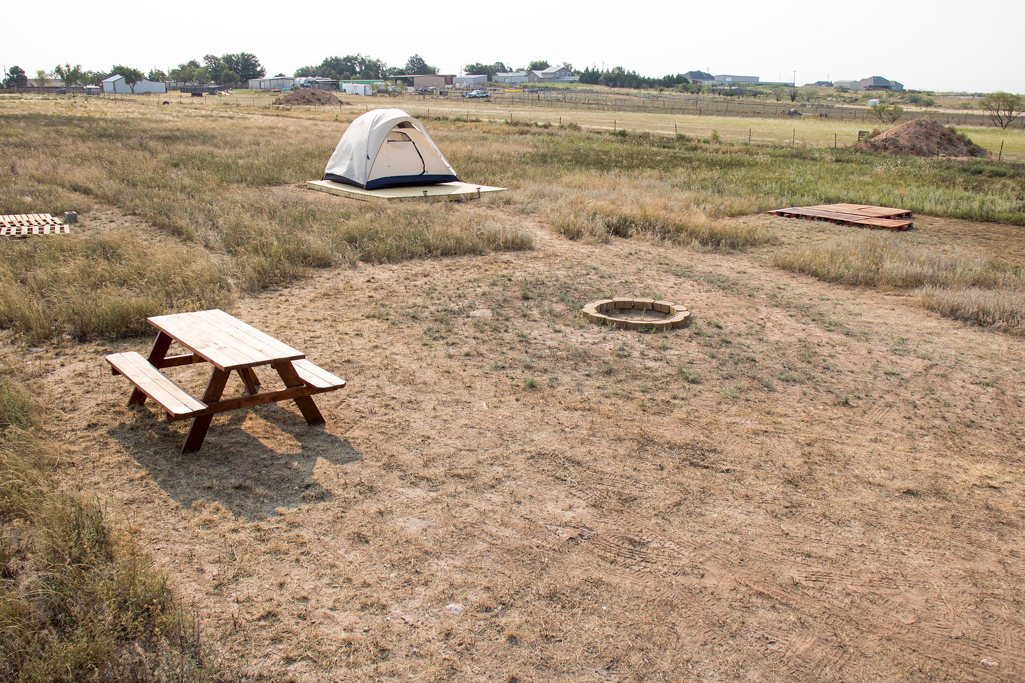 Put your tent on the platform or on a flat part of the ground. 3 different sites are available.