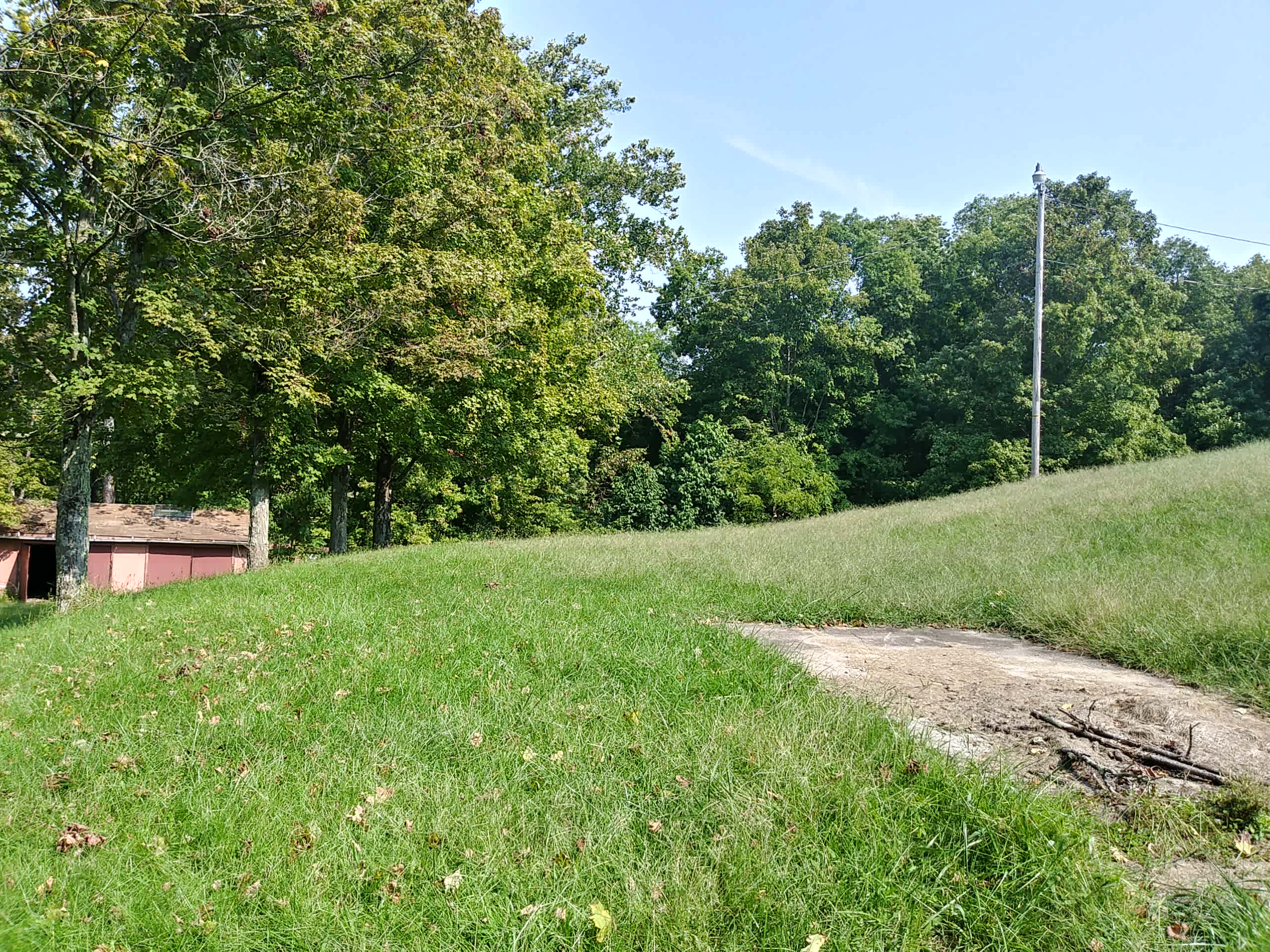 Picnic table (to be placed) and fire area.
Can be used for parking at level of tents