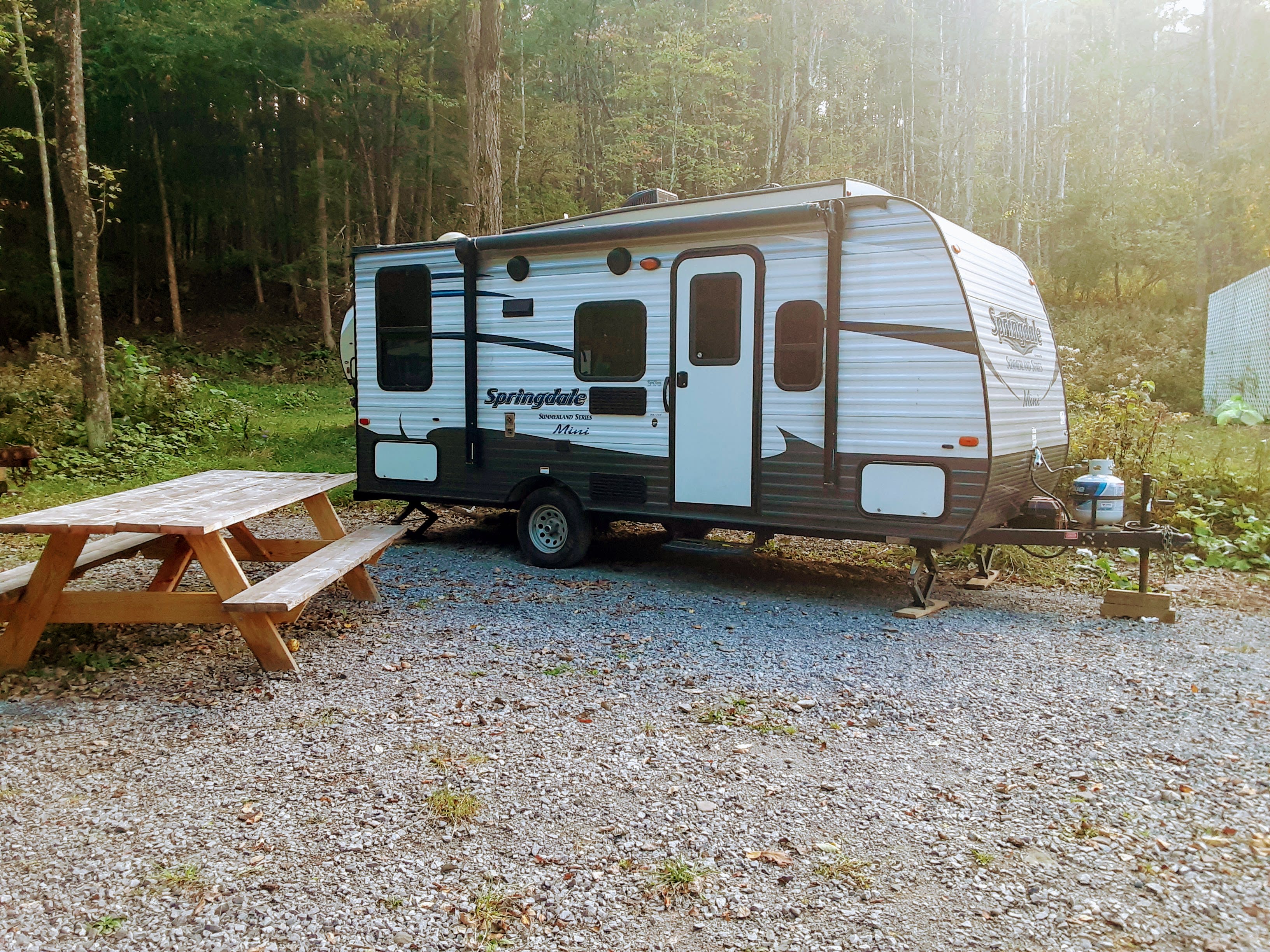 View of RV Camper and picnic table.