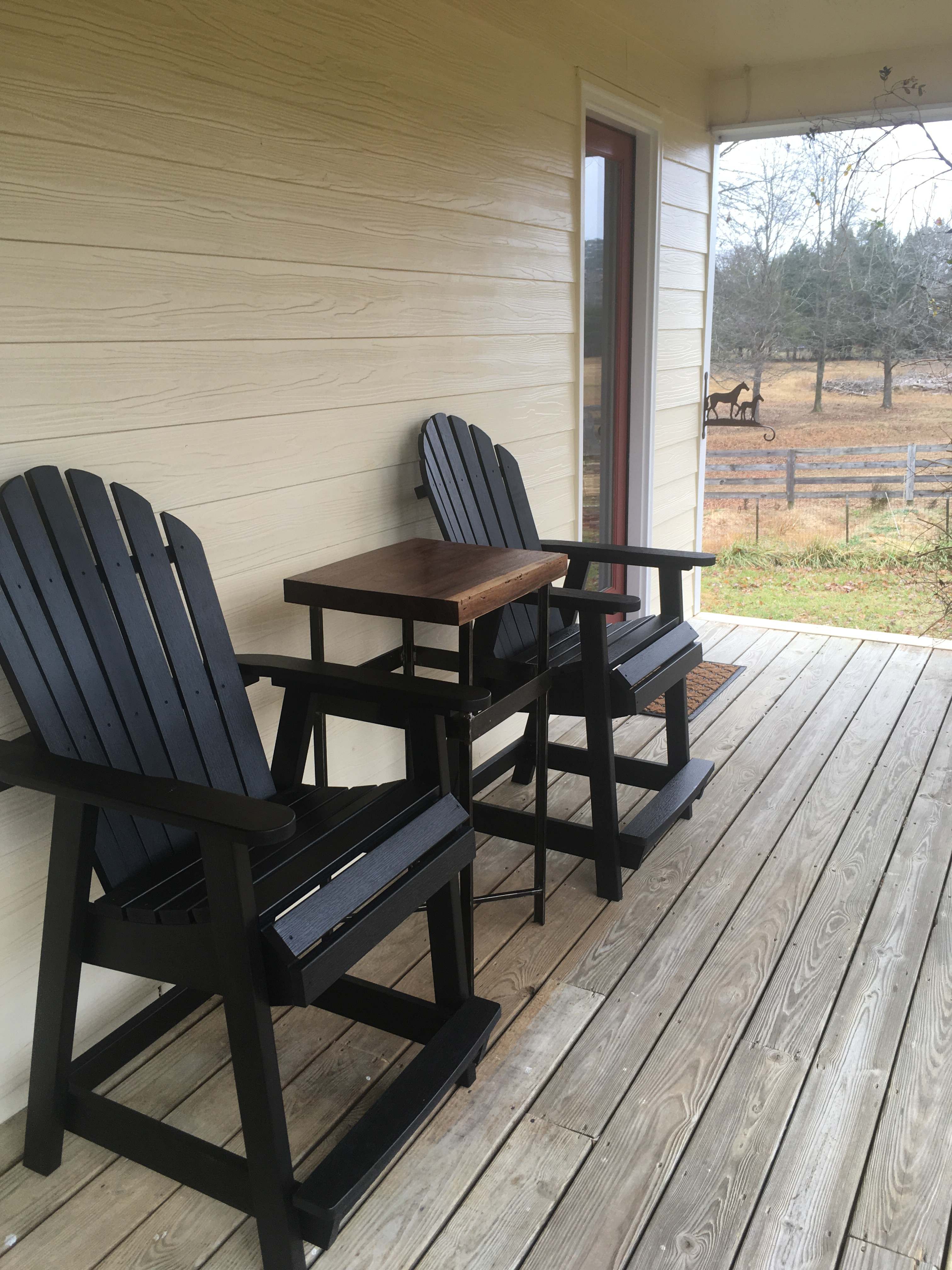 Comfortable chairs to enjoy the farm view from the porch. 