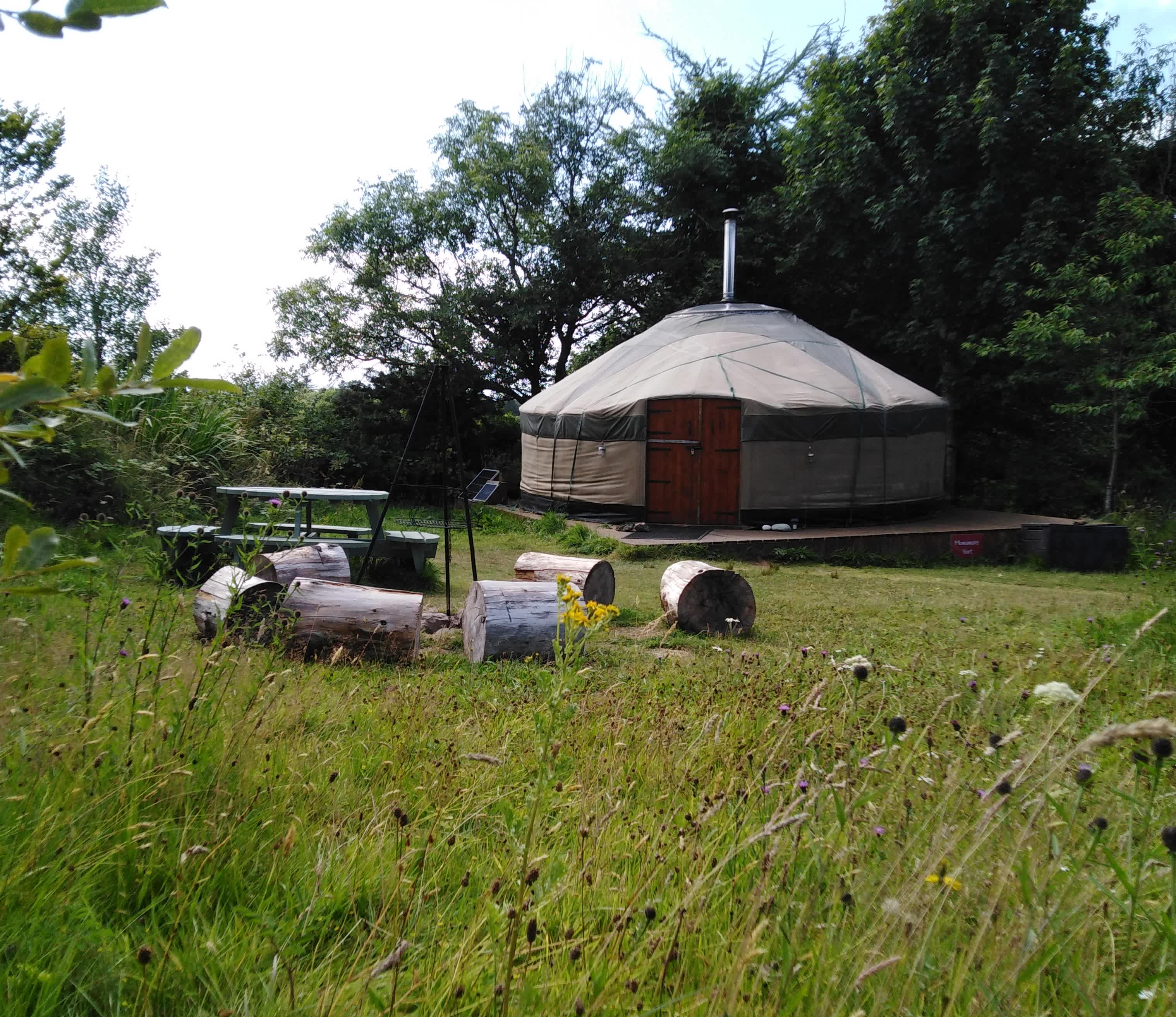 Monamore yurt with fire pit, picnic bench and outdoor cooking equipment