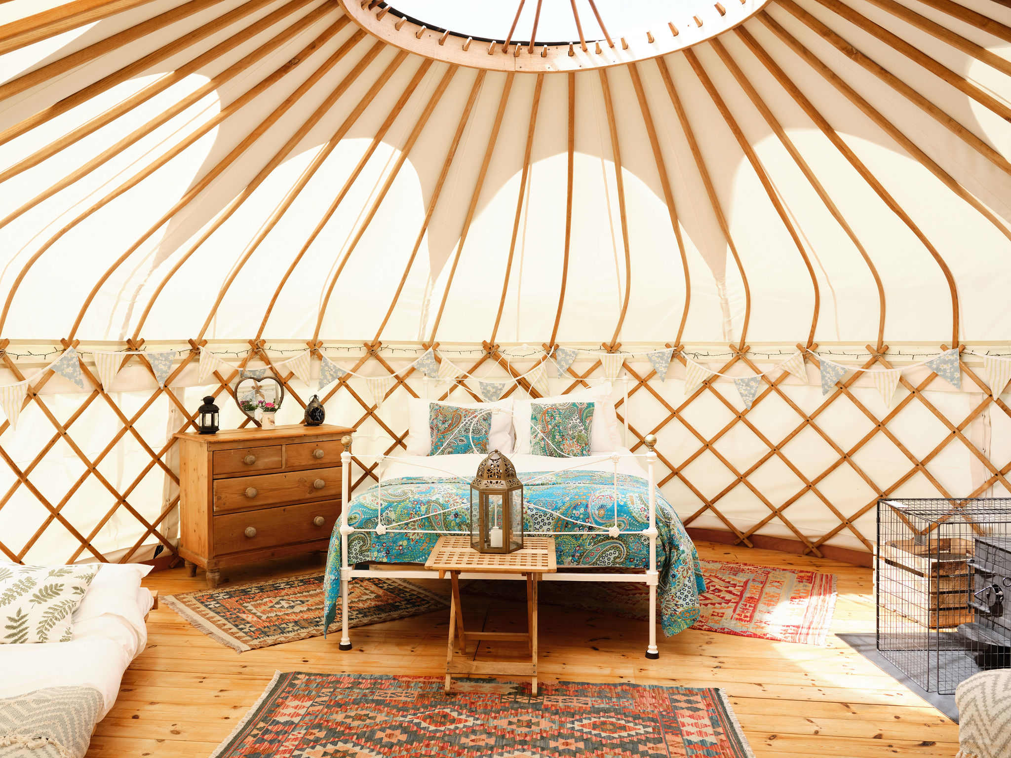 Each yurt has  its own unique style with brass and iron beds and feather duvets and wood burning stove.   