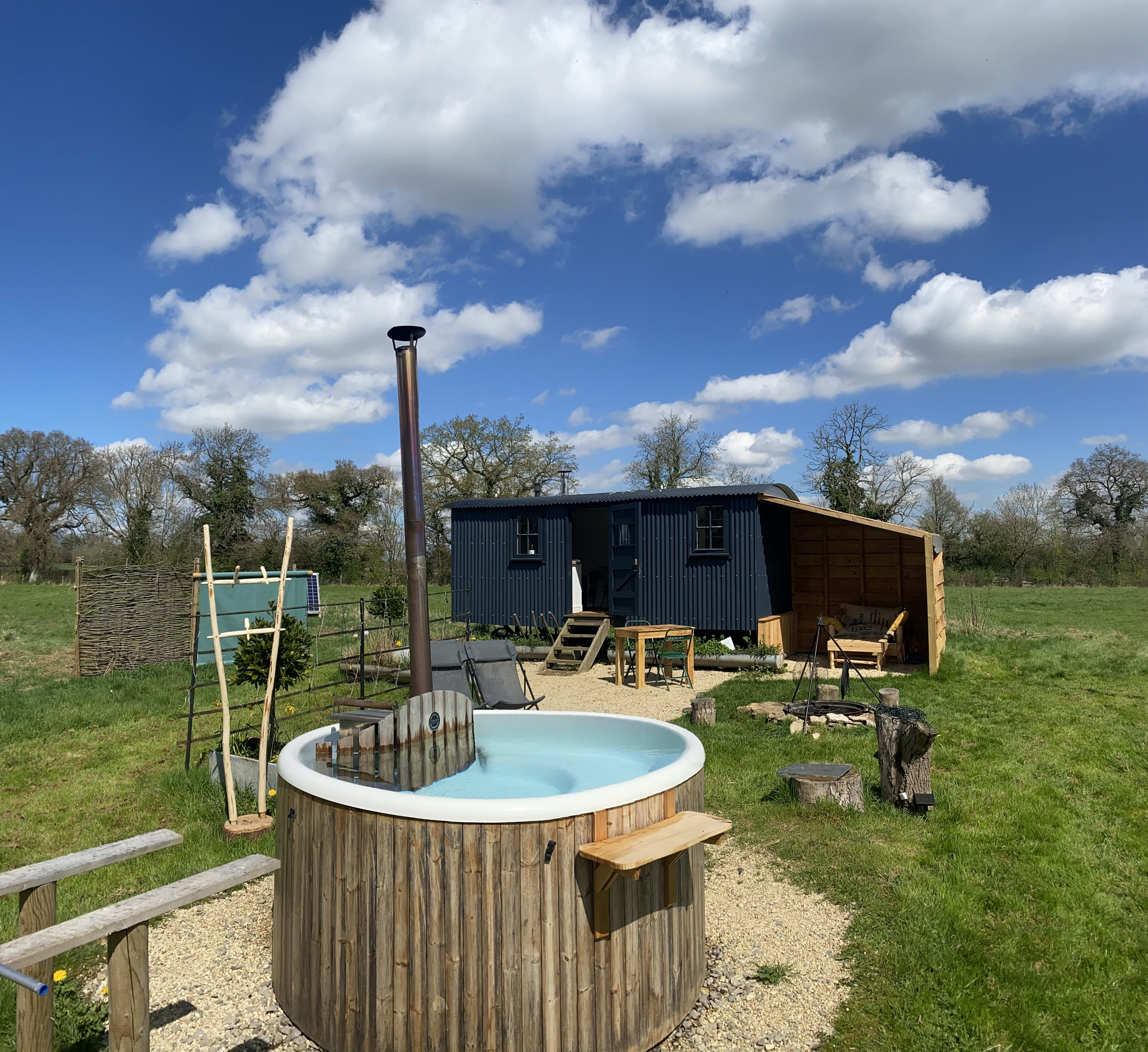 We have 3 off grid shepherds huts with hot tubs in a secluded field separate to the glamping campsite. These are for adults only.