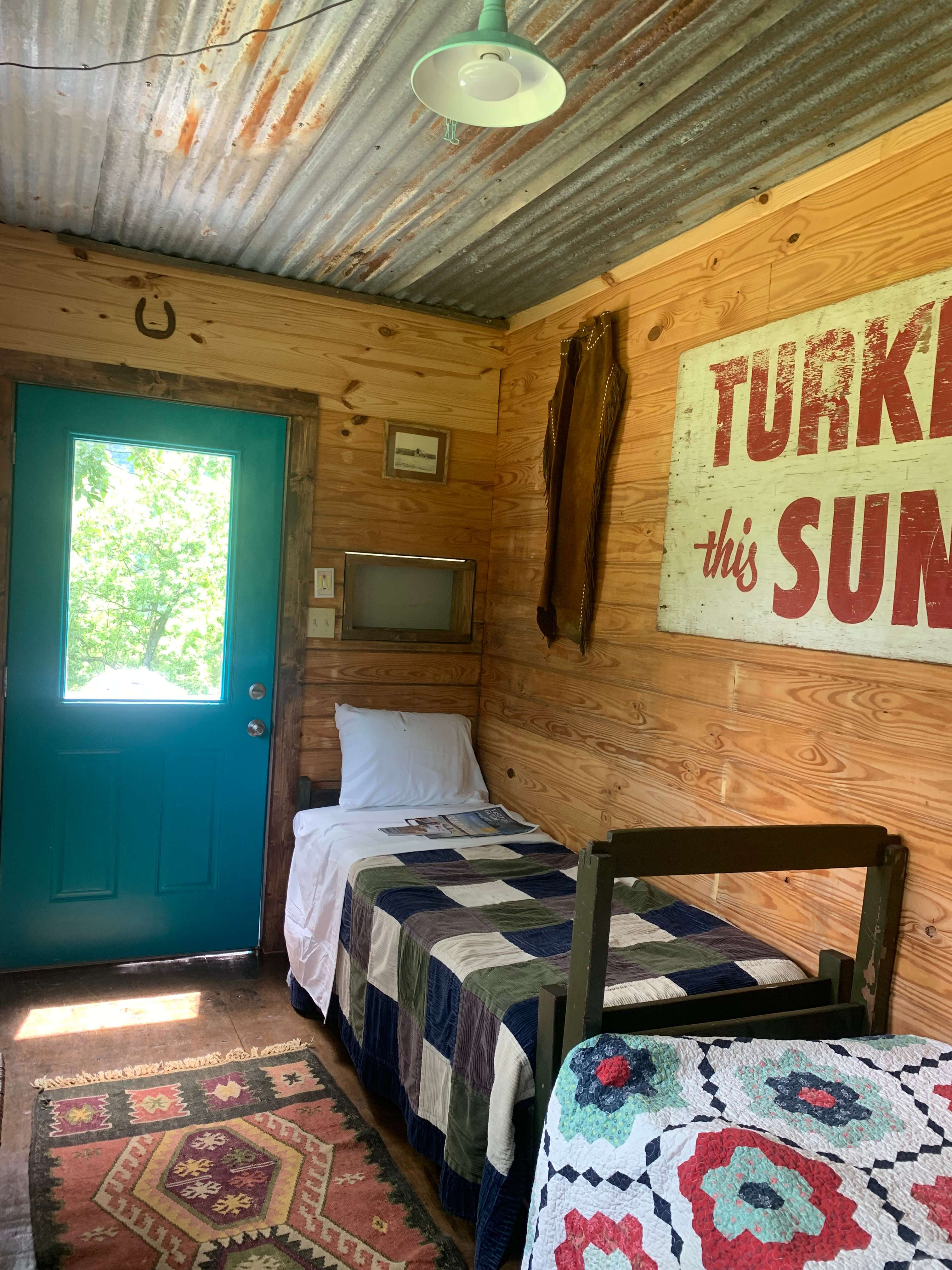 Insulated walls with wood planks, tin ceiling