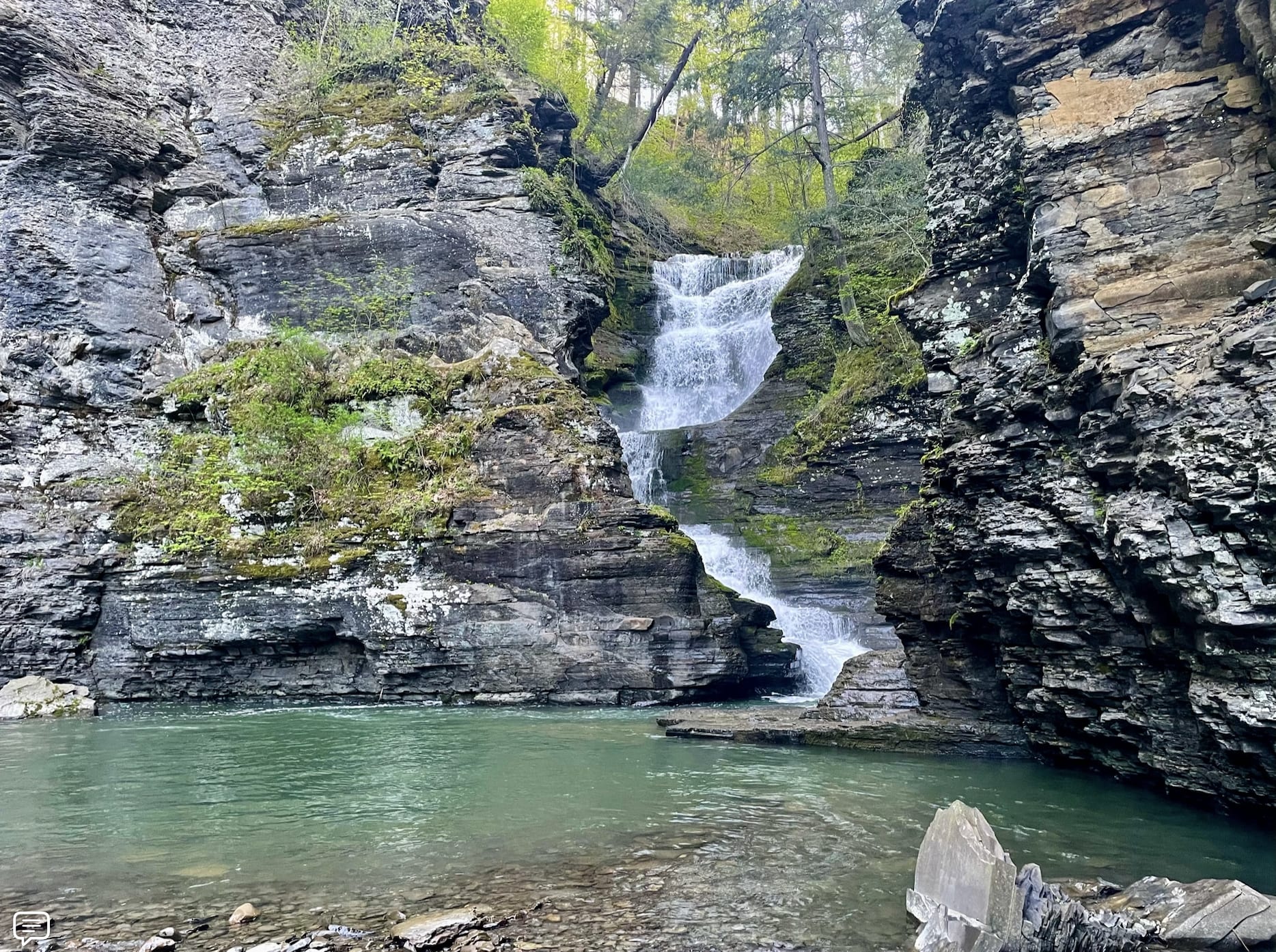 the waterfall. The eye of water at the base of the falls is about 7' deep.  The big pool is 3-5 feet deep. There are other swimming holes along the river as well as native clay beds for purification masks or making little figures you can bake in the campfire.