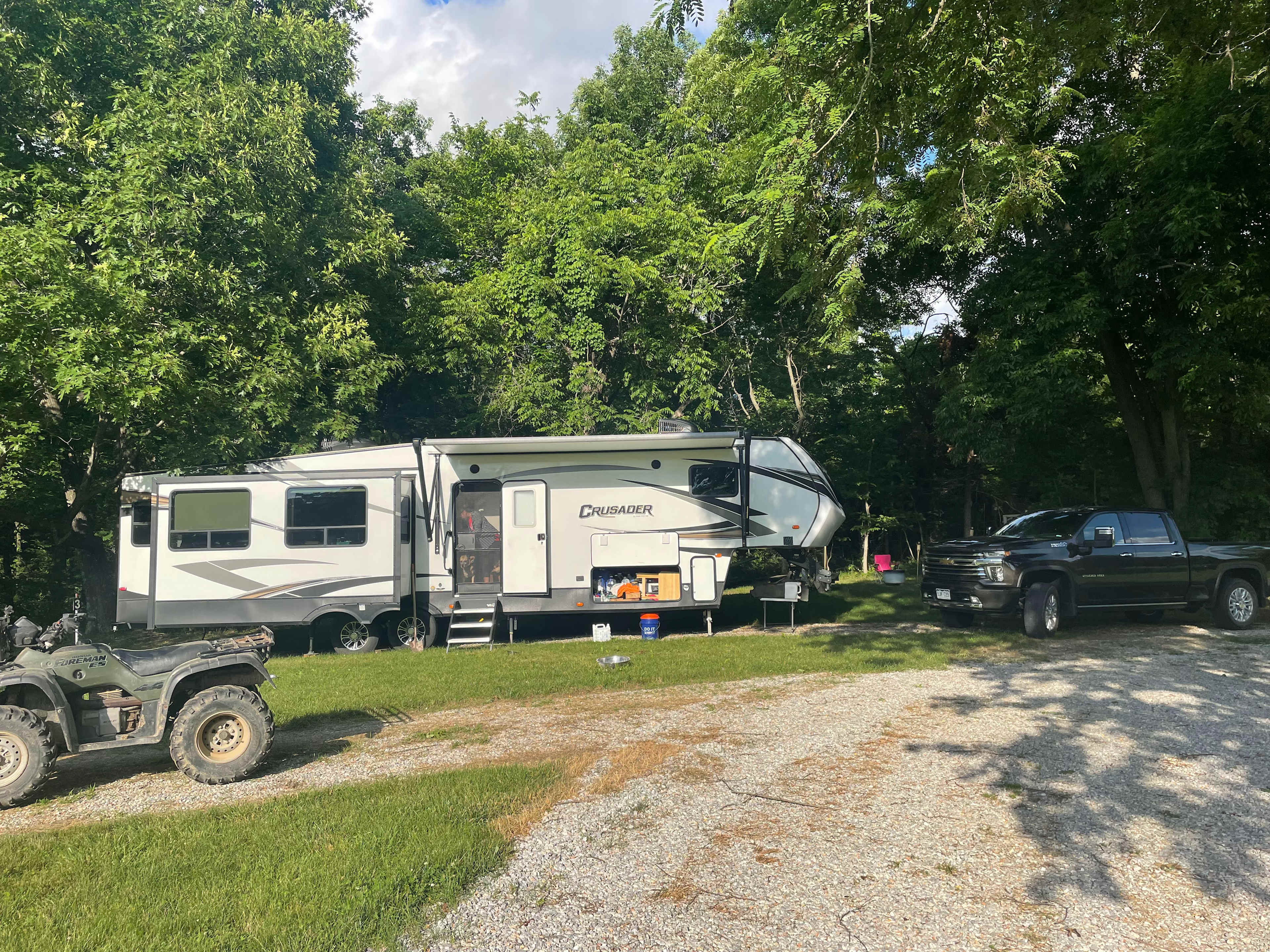 Site 3 with a 5th wheel camper backed in to the spot.