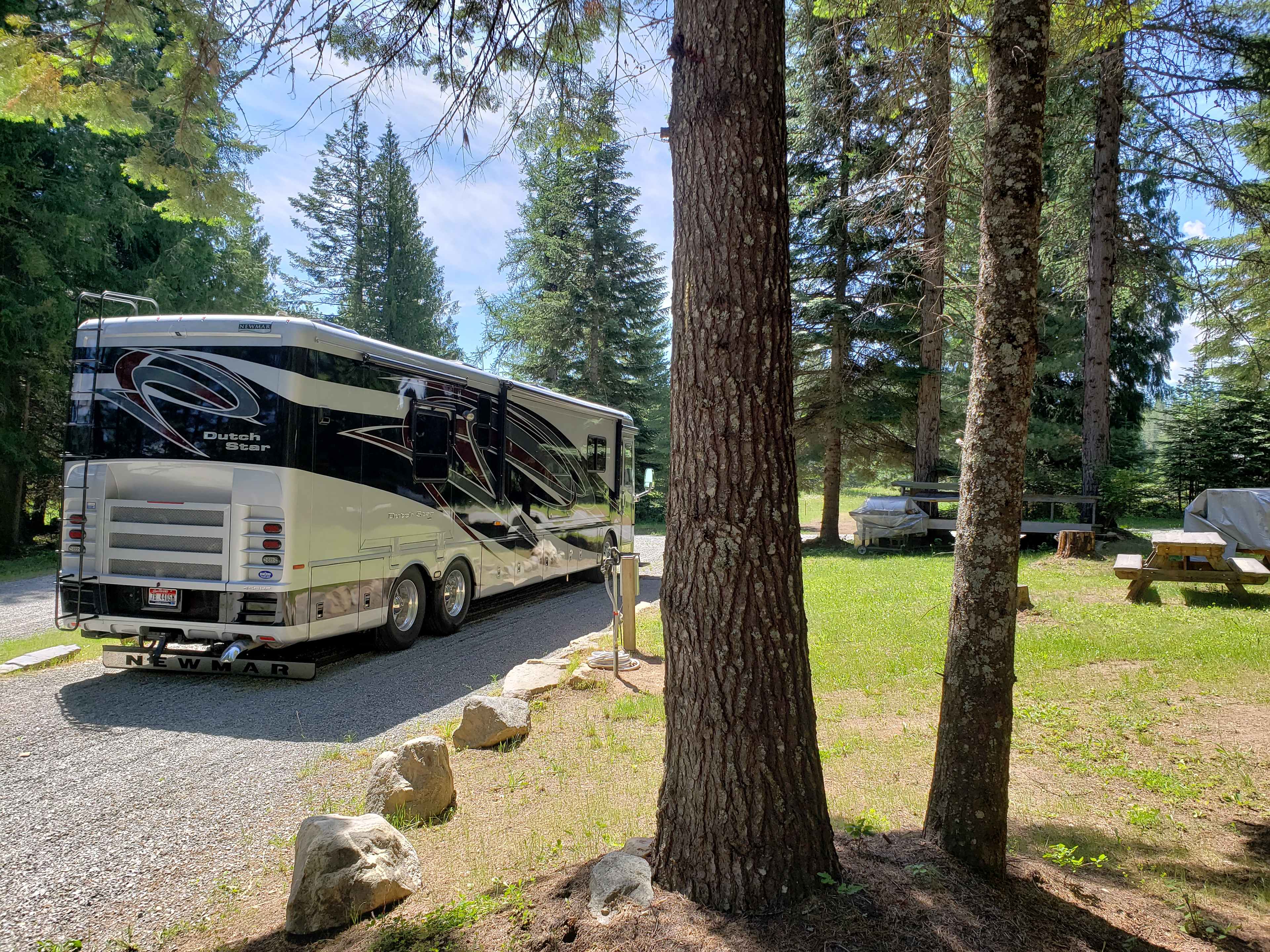 Site 1 is spacious and includes 50 amp electrical service and water hookup.  RV's up to 55' and room for parking 2 vehicles.  The lot is fairly open but is surrounded by trees.  Includes a fire pit, picnic table, firewood, a big deck/table and a bbq.