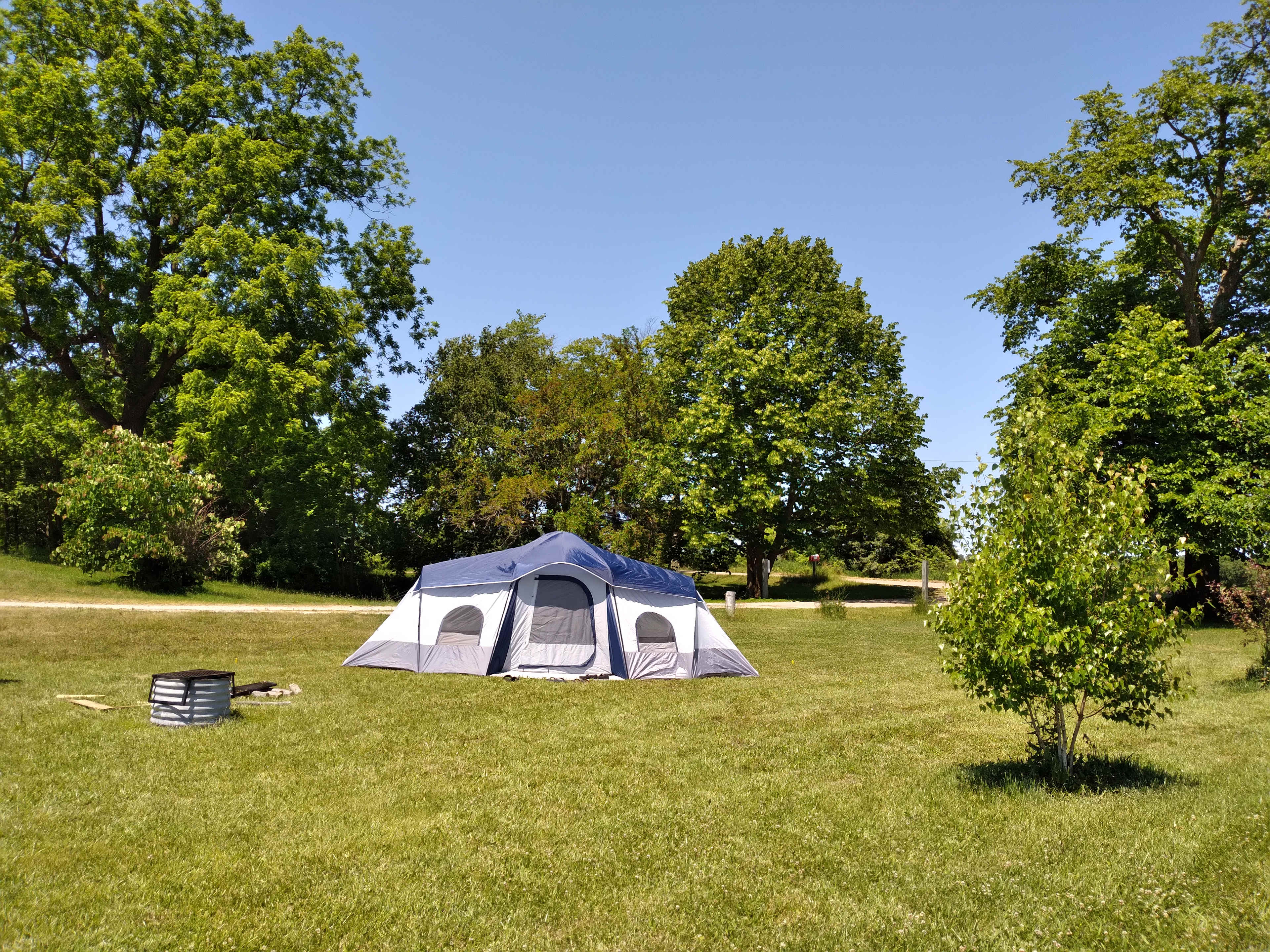 Site 3 includes a fire ring and fire wood. Extra tables and chairs are available. Located with easy access to the Events Barn bathrooms and shower.
