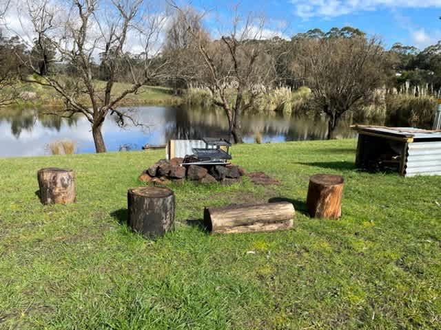 Upgraded changes to Site 1, inclusion of a Firewood cabinet and a swing over BBQ plate and grill.