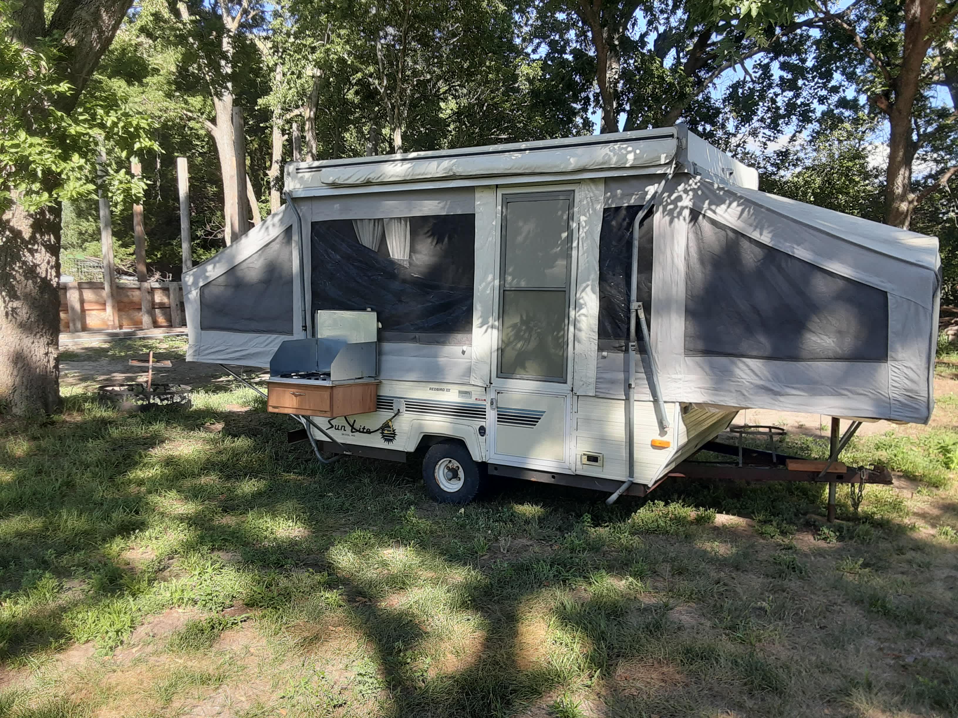 Shady pop-up camper, available during the warm season.