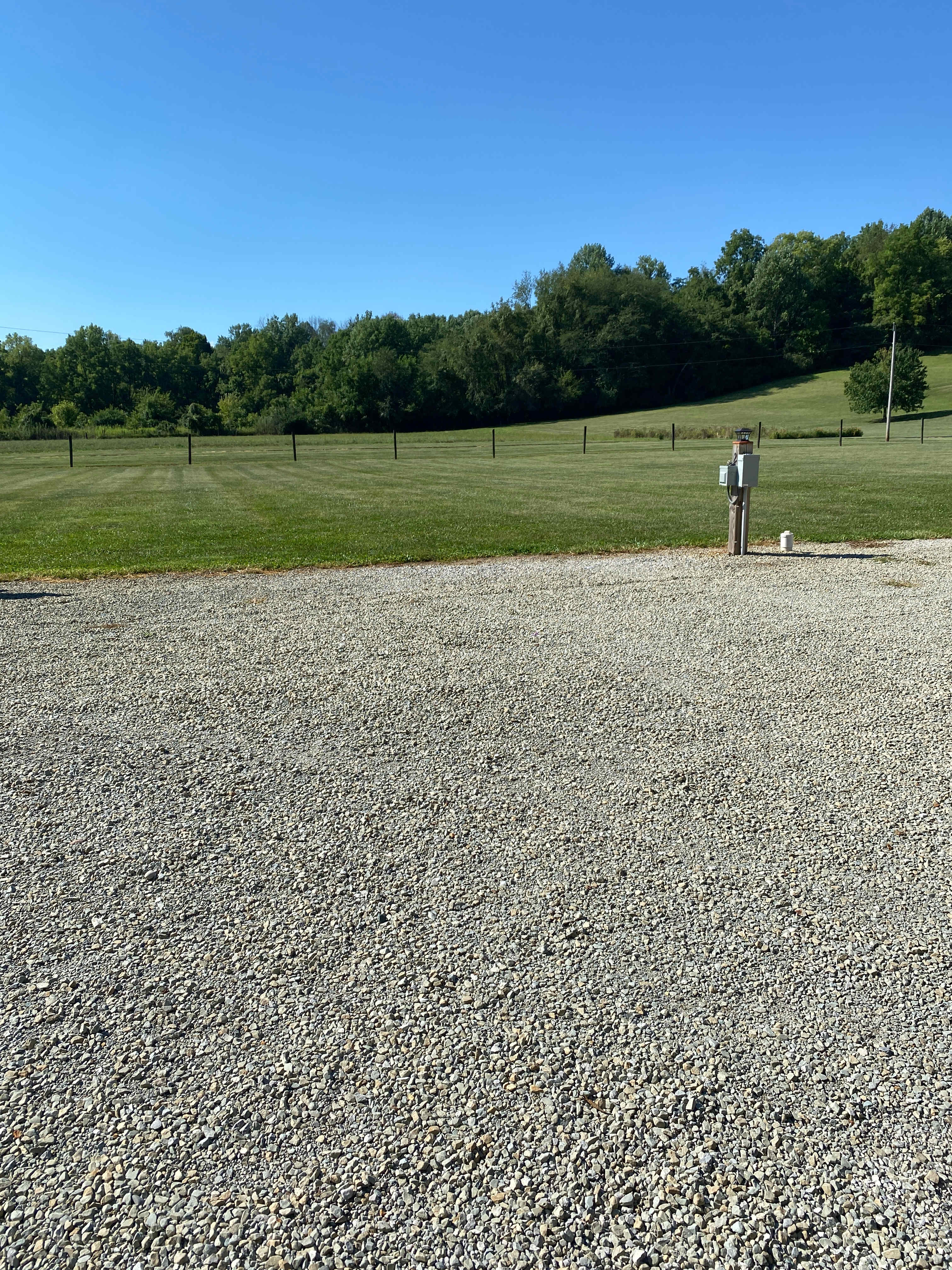Site #2.   The grass would be behind your camper.
