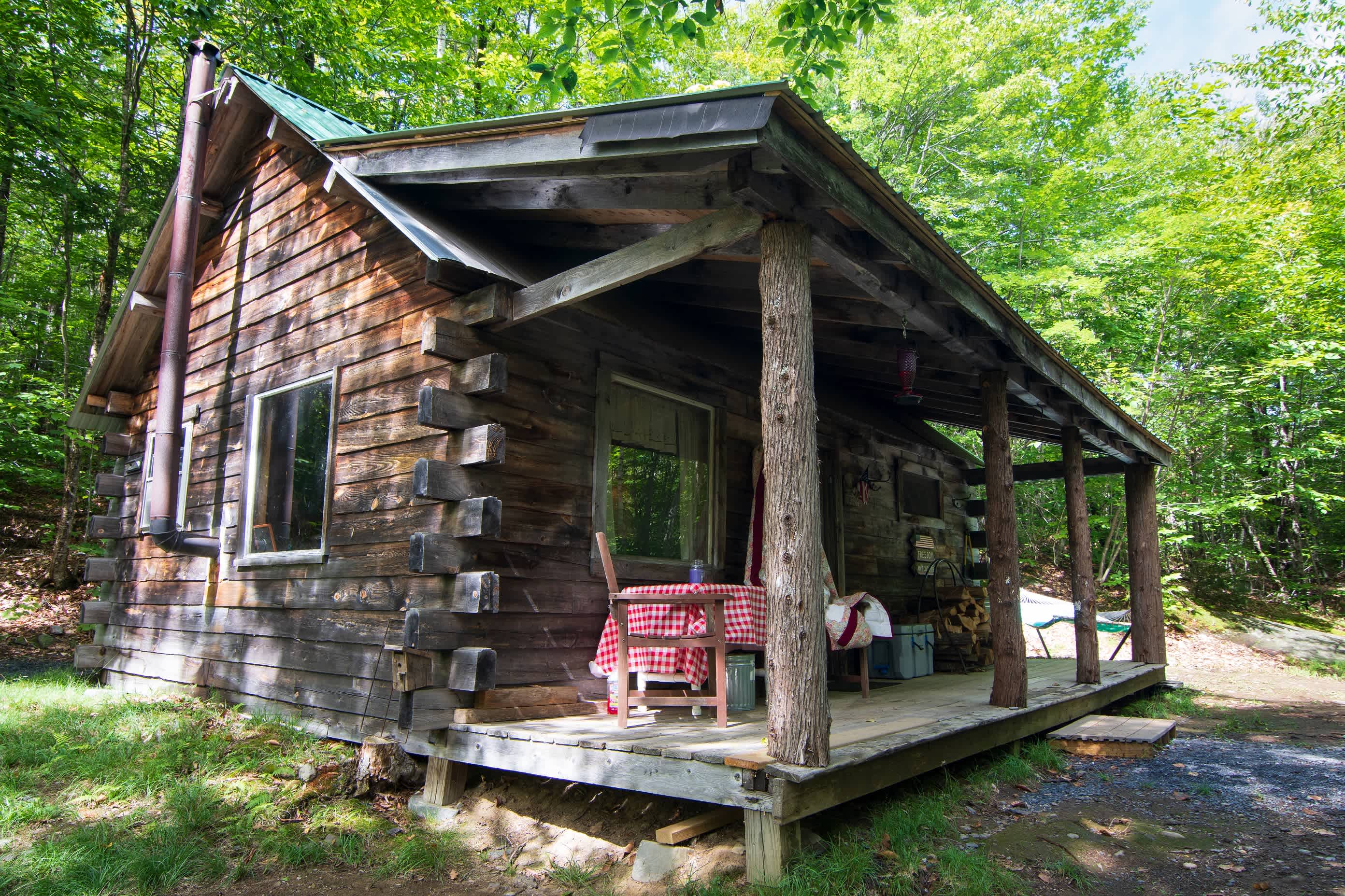 Outside the cabin there's a nice little porch, a firepit, and a patio table & chairs