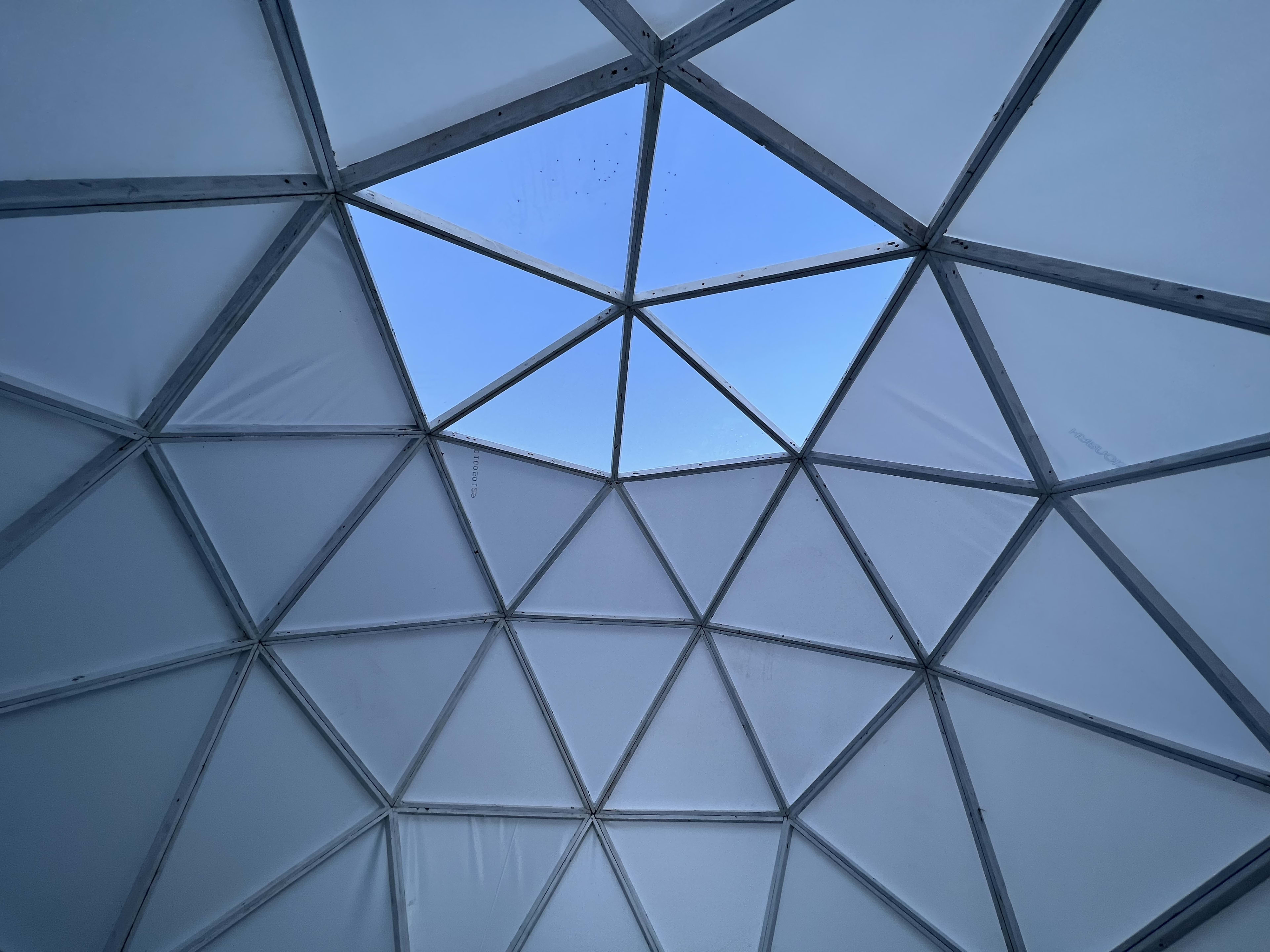 Inside the geodesic dome cabin looking up at the skylight.