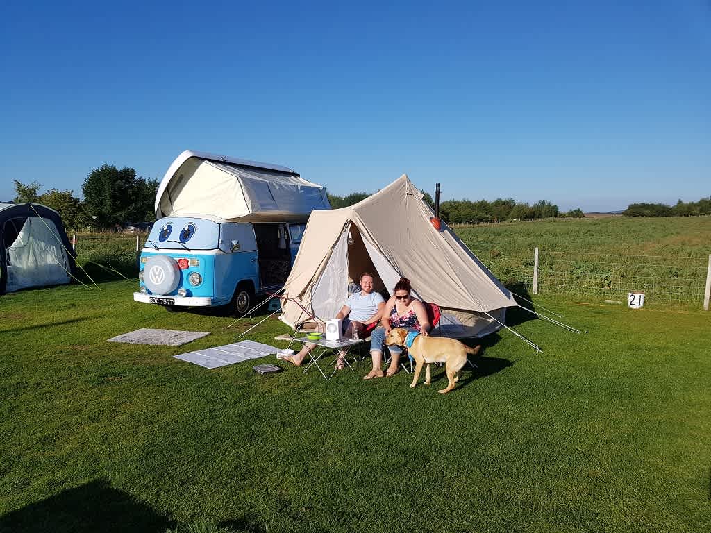 Campervan and tents in the Stack Yard.