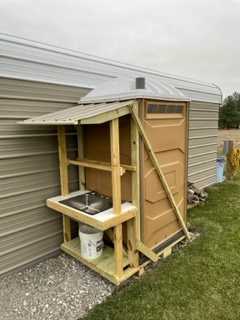 Portable restroom located at other spot 50' away