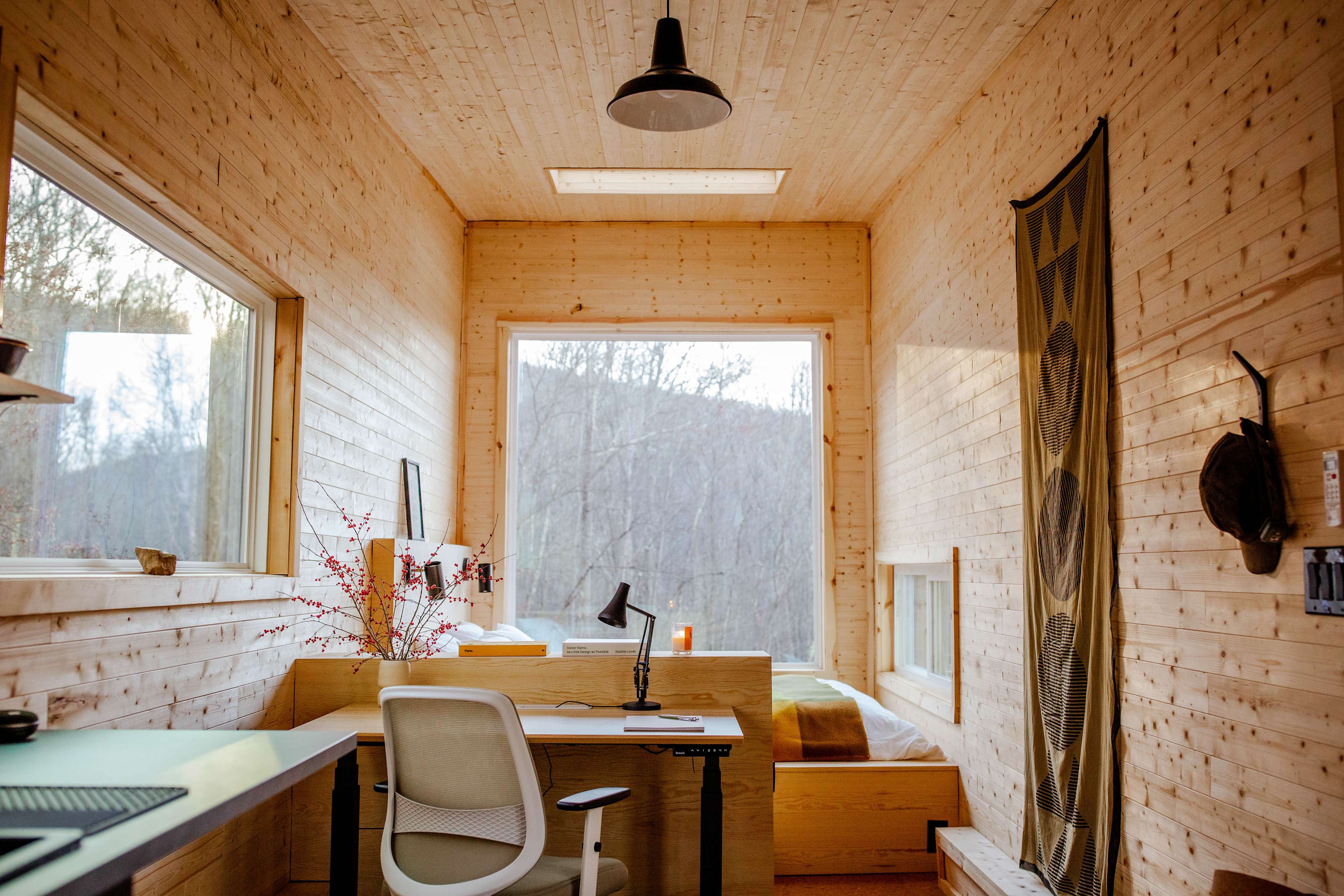 The view from the kitchen. A large picture window frames the bed, with a skylight above for the clear nights :)