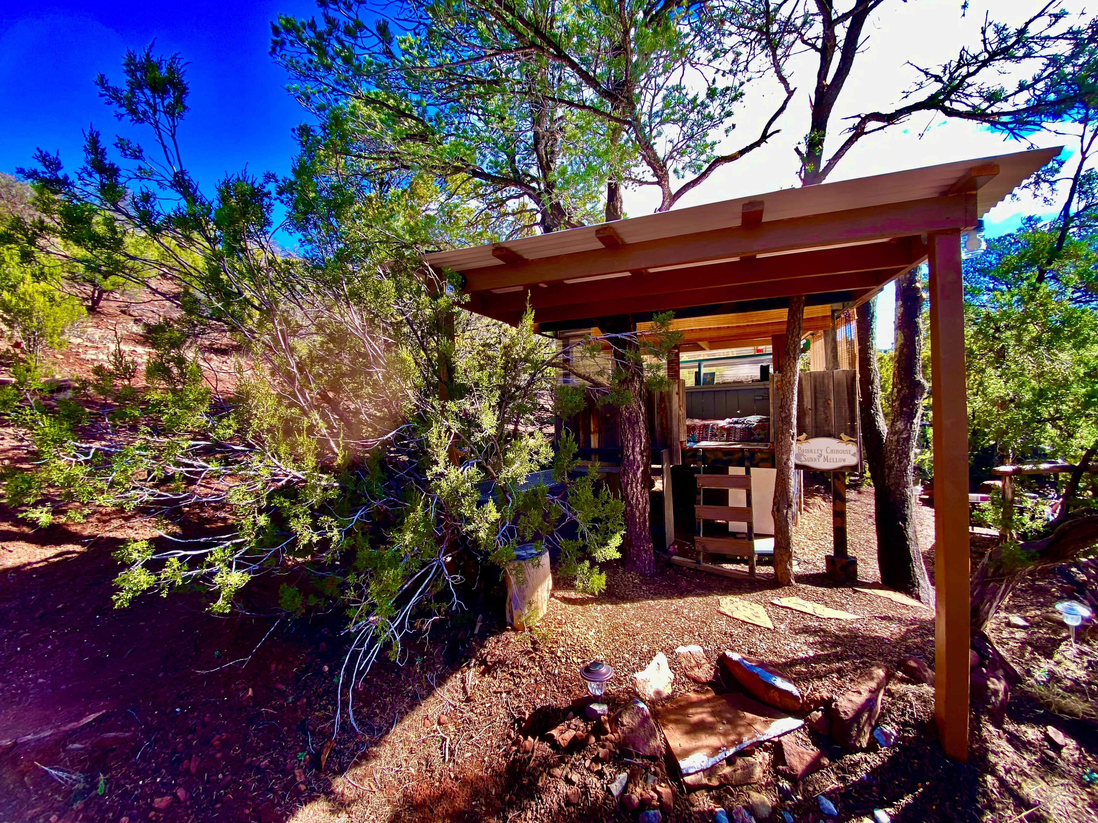 New Awning Over Front of The Chi-Treehouse! Around the back is the Kitchen, Dining, Fire Pit, Sunning Lounge, New BBQ, Bridge to the Private Outdoor Shower and Bath... And Just a 10 Second Walk over the bridge!