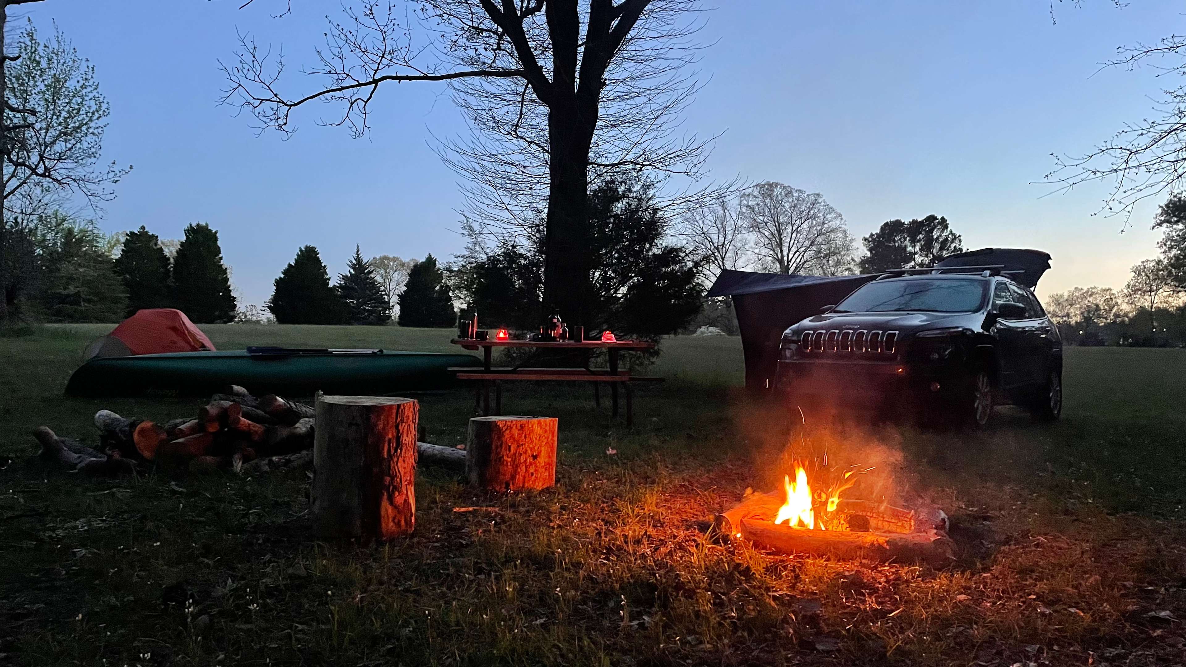 Sunset camp setup, plenty of comfort. Includes: picnic table, plenty of firewood, and a nice view of the water!