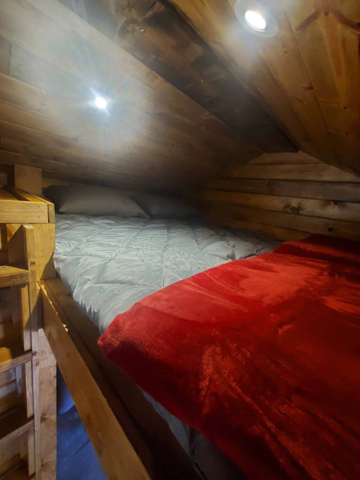 loft has 4 inch foam pad , usually has 2 sleeping bags with liners that we clean between each guest. reg bedding available