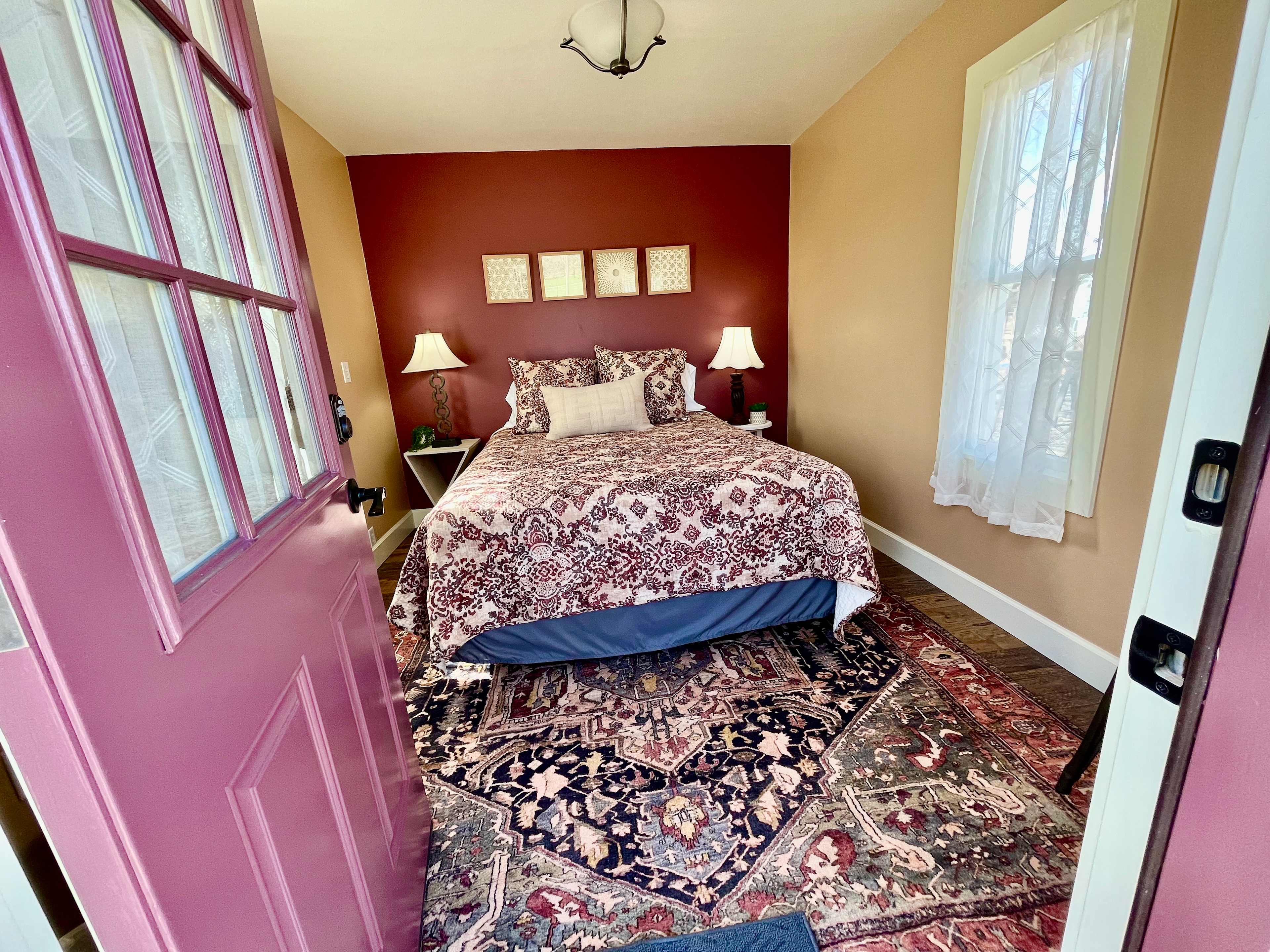 From the entry way- warm colors of red, rust, and blue inside
