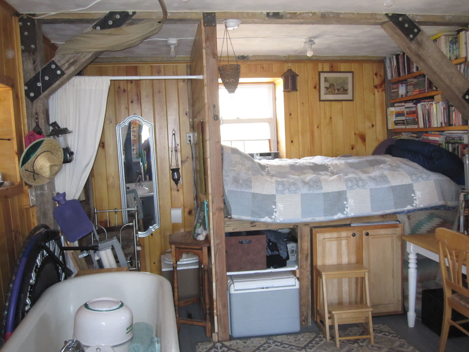 facing east with bed, bathtub and composting toilet on the back left of photo 
