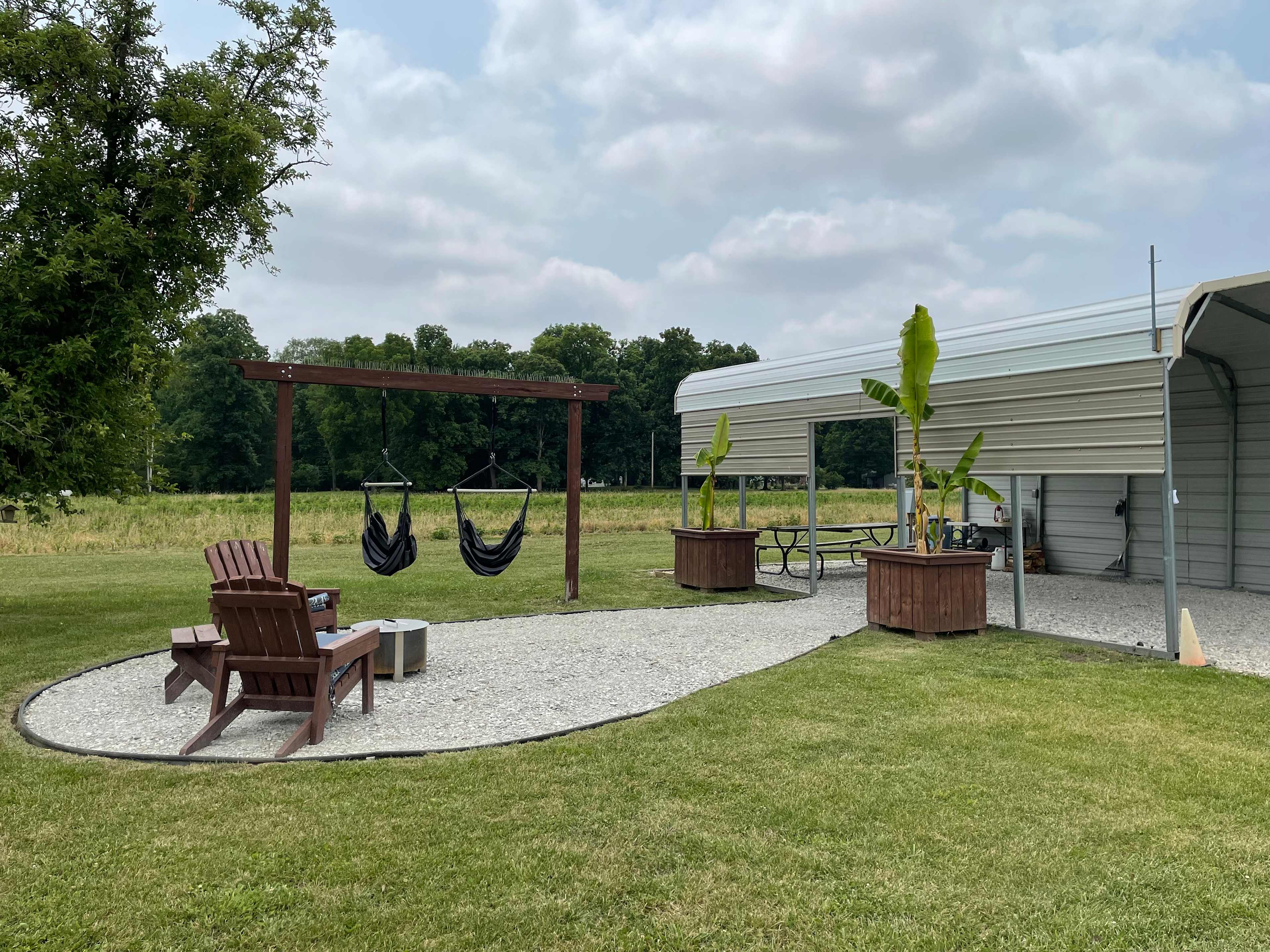 Relax here! New hammock chairs, padded adirondack chairs and a sweet smokeless fire pit! 
